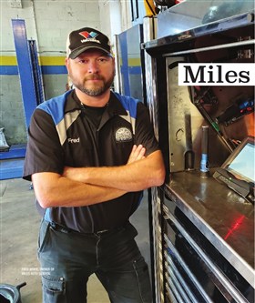 Fred, owner of Miles Auto Service, in his shop