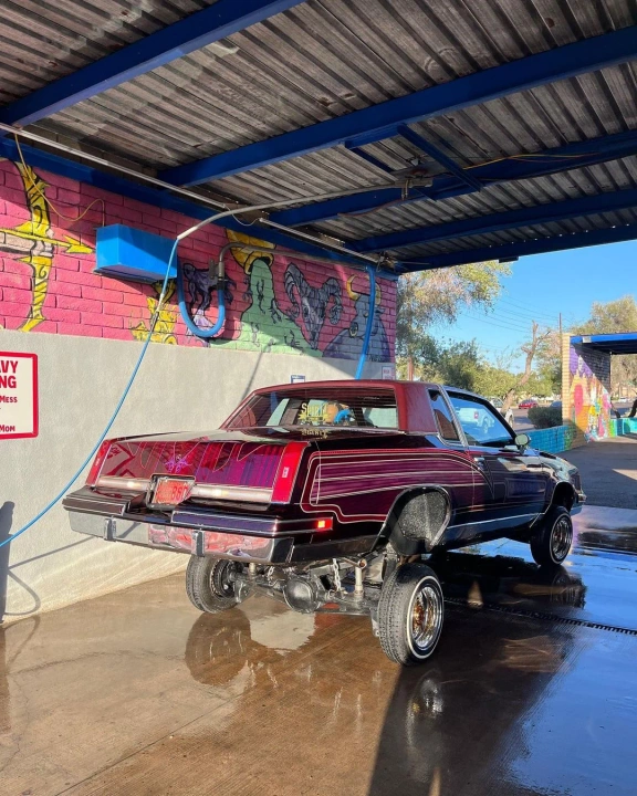 Bright classic hot rod on hydraulics at Bobby E's Car Wash, Tempe