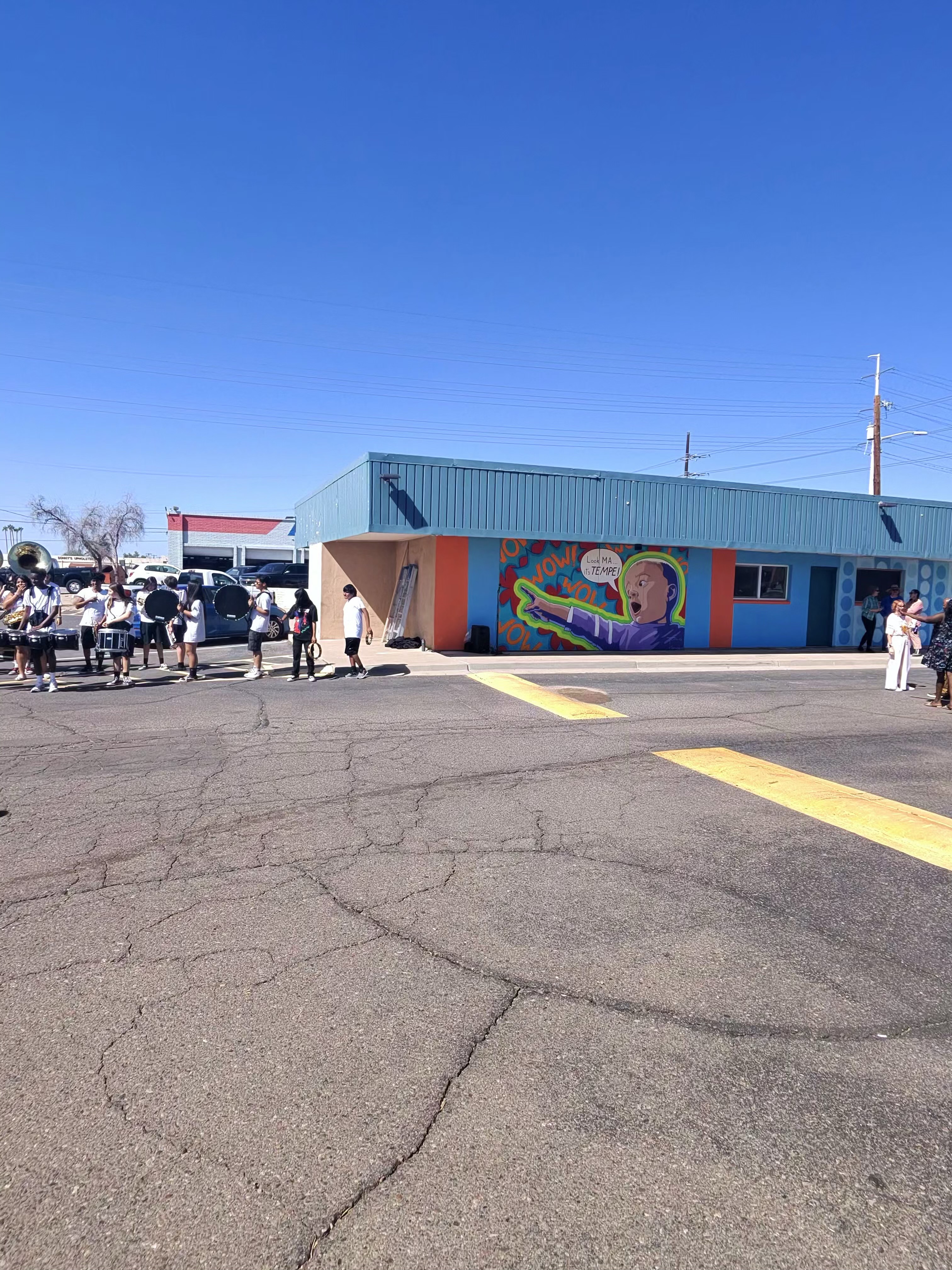 Community gathering at Bobby E's Car Wash by the new mural in Tempe