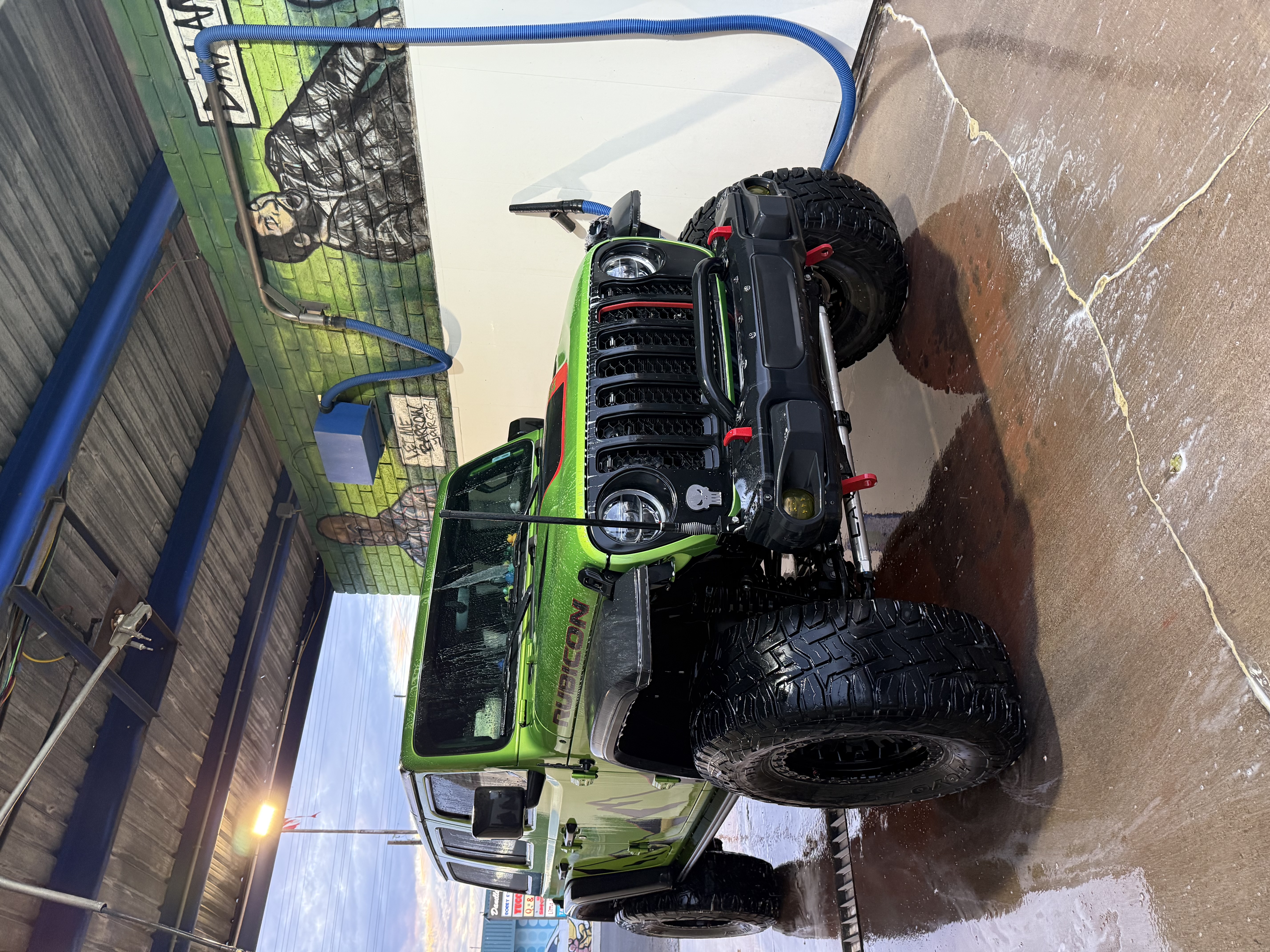 Jeep Gladiator getting a high-pressure rinse in a Bobby E's bay