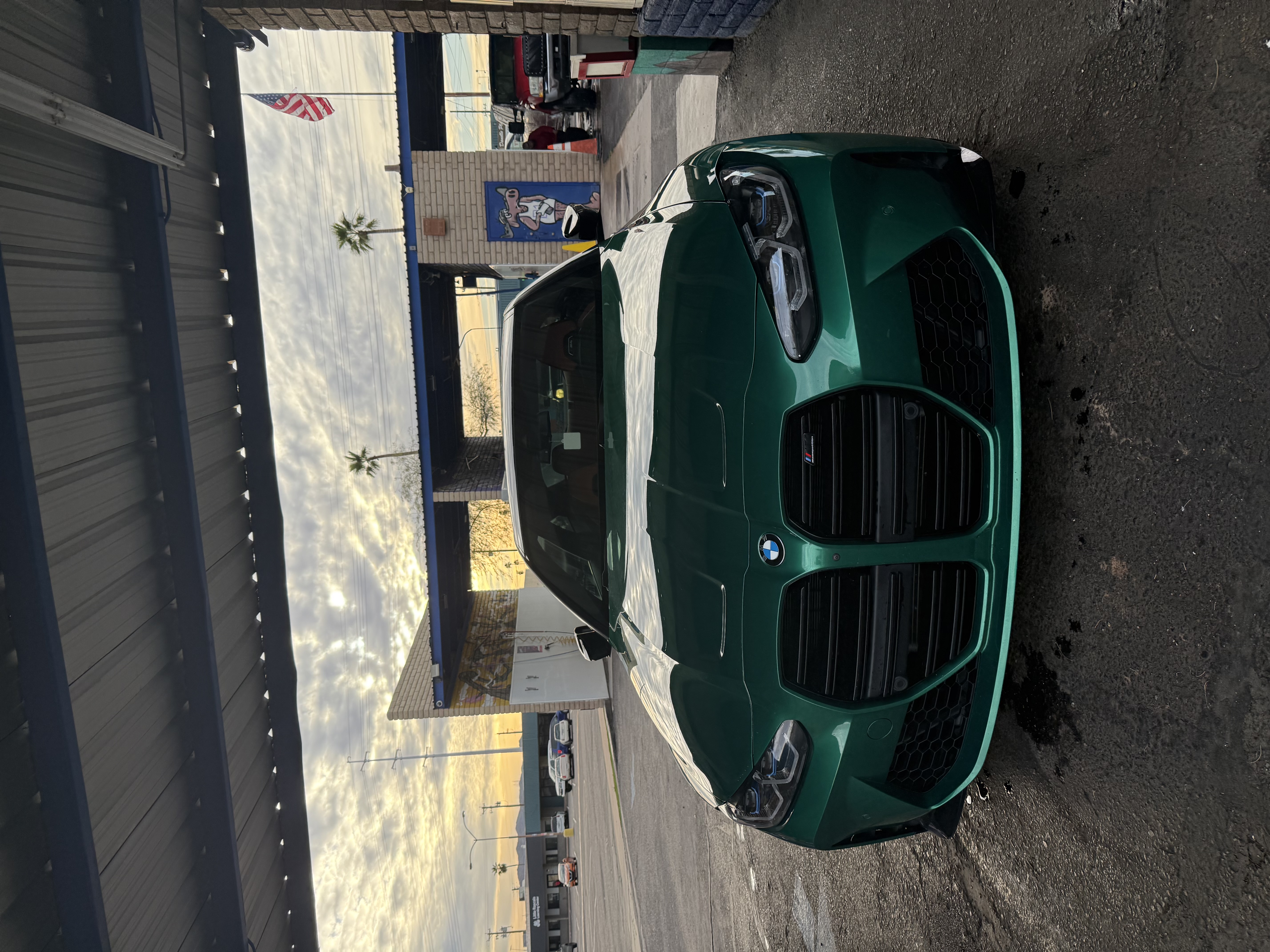 Green BMW in a Bobby E's self-serve bay