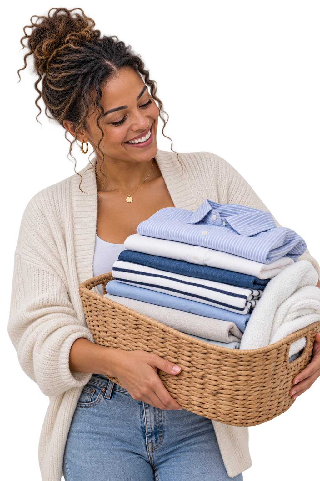 Smiling woman holding a fresh, neatly folded stack of laundry and knitwear