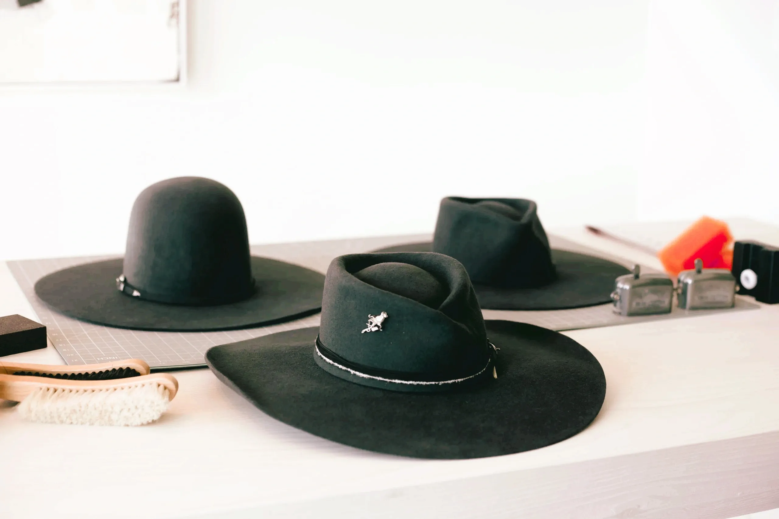 Open-crown felt hats ready for hand shaping at Ace High Hat Bar in Calgary