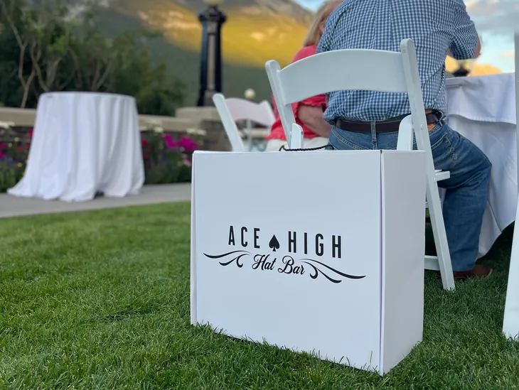 Ace High Hat Bar hat box at an outdoor corporate event