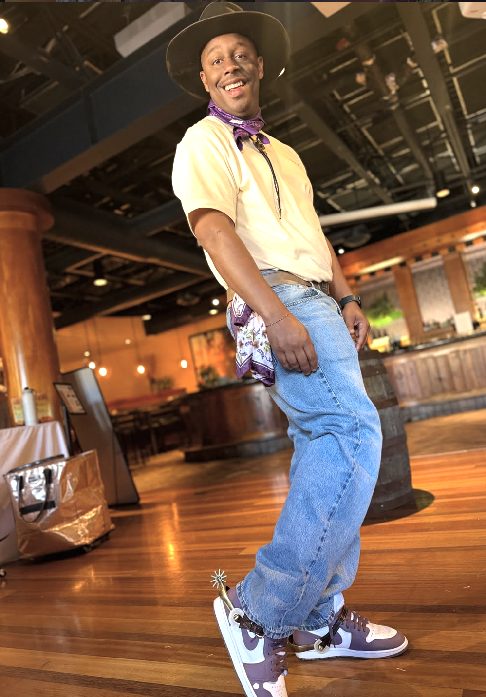 Guest dancing in a custom cowboy hat at a corporate party
