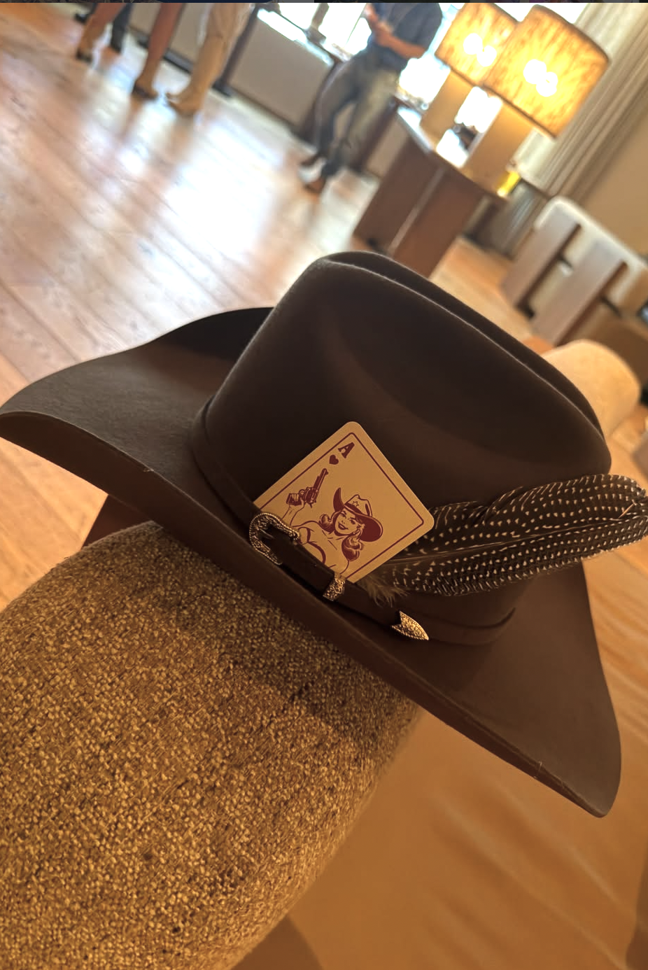 Brown pre-shaped felt hat with feather and playing card