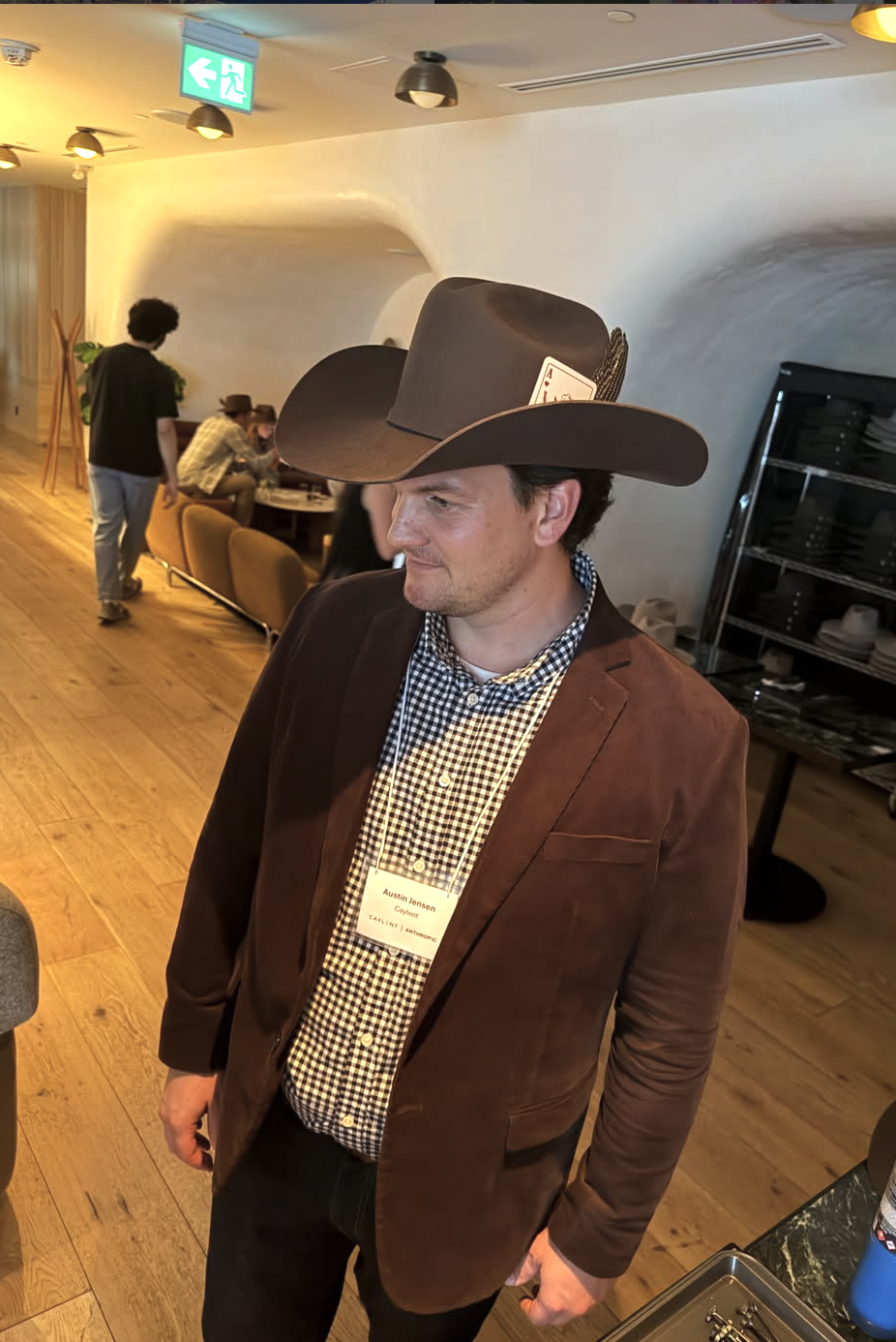 Corporate event guest wearing a custom brown felt hat