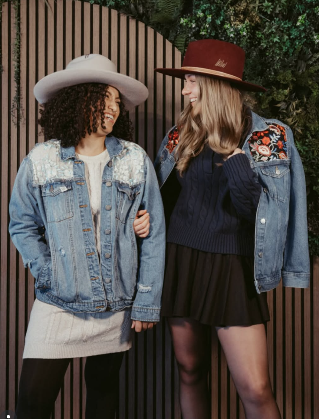 Two friends in custom felt hats and denim jackets