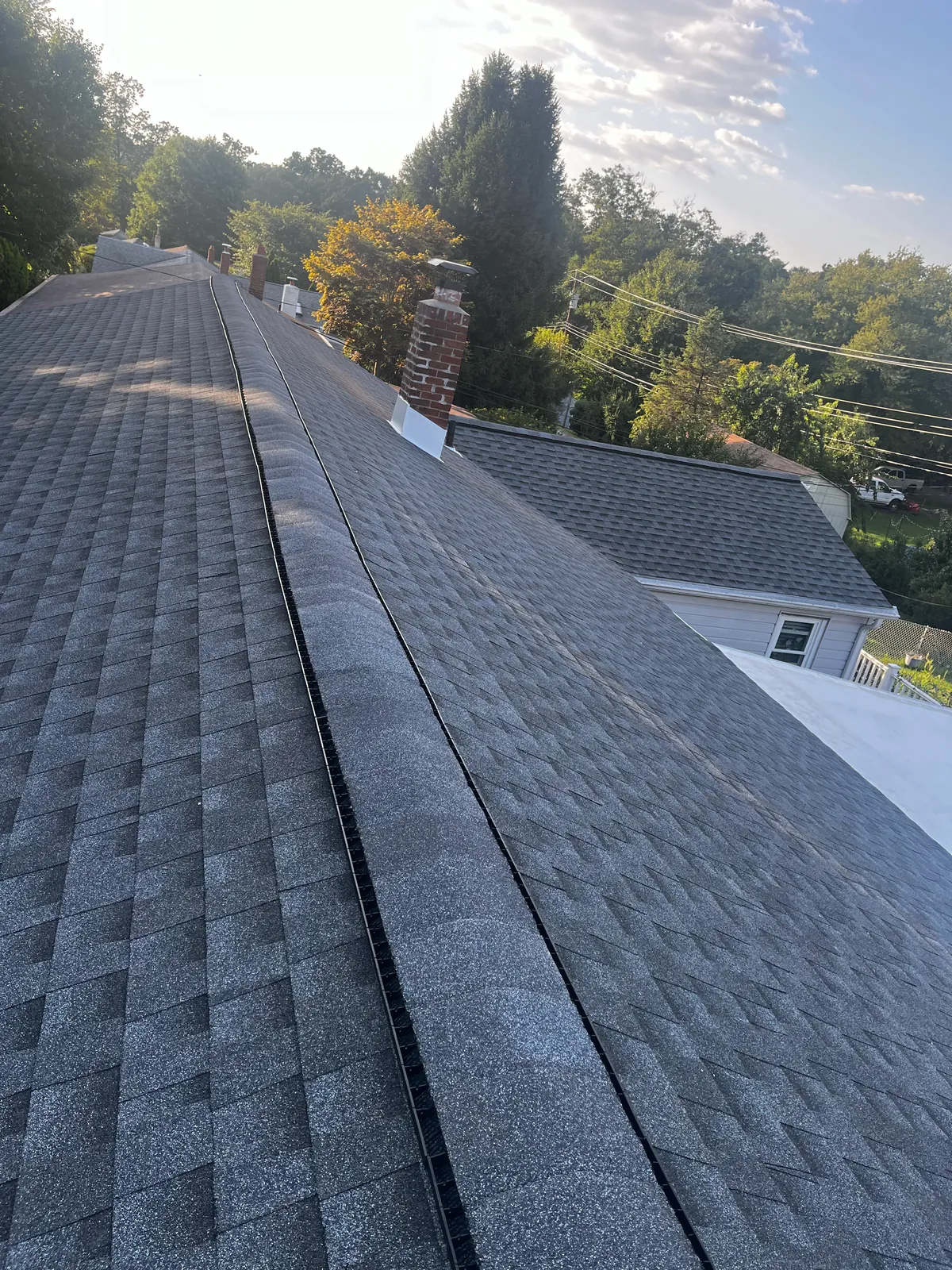 Completed residential shingle roof by Michael John Contractors
