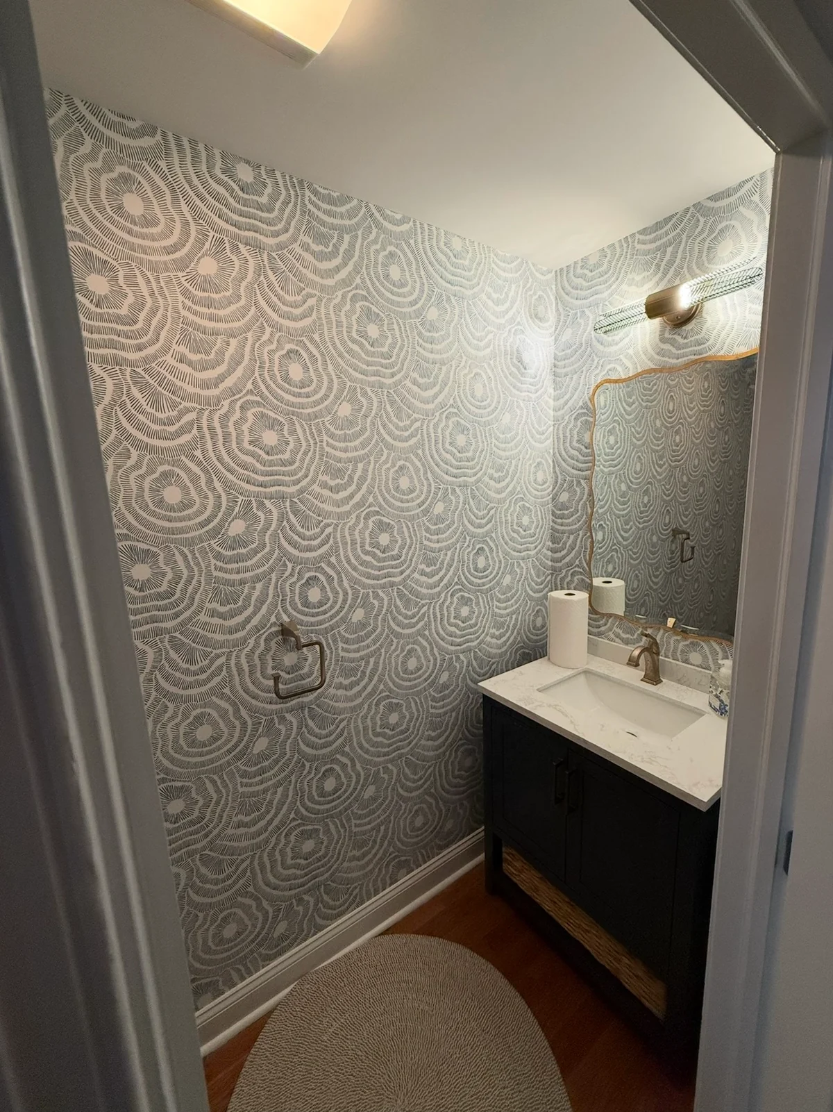 Sea Isle City powder room with a patterned wall