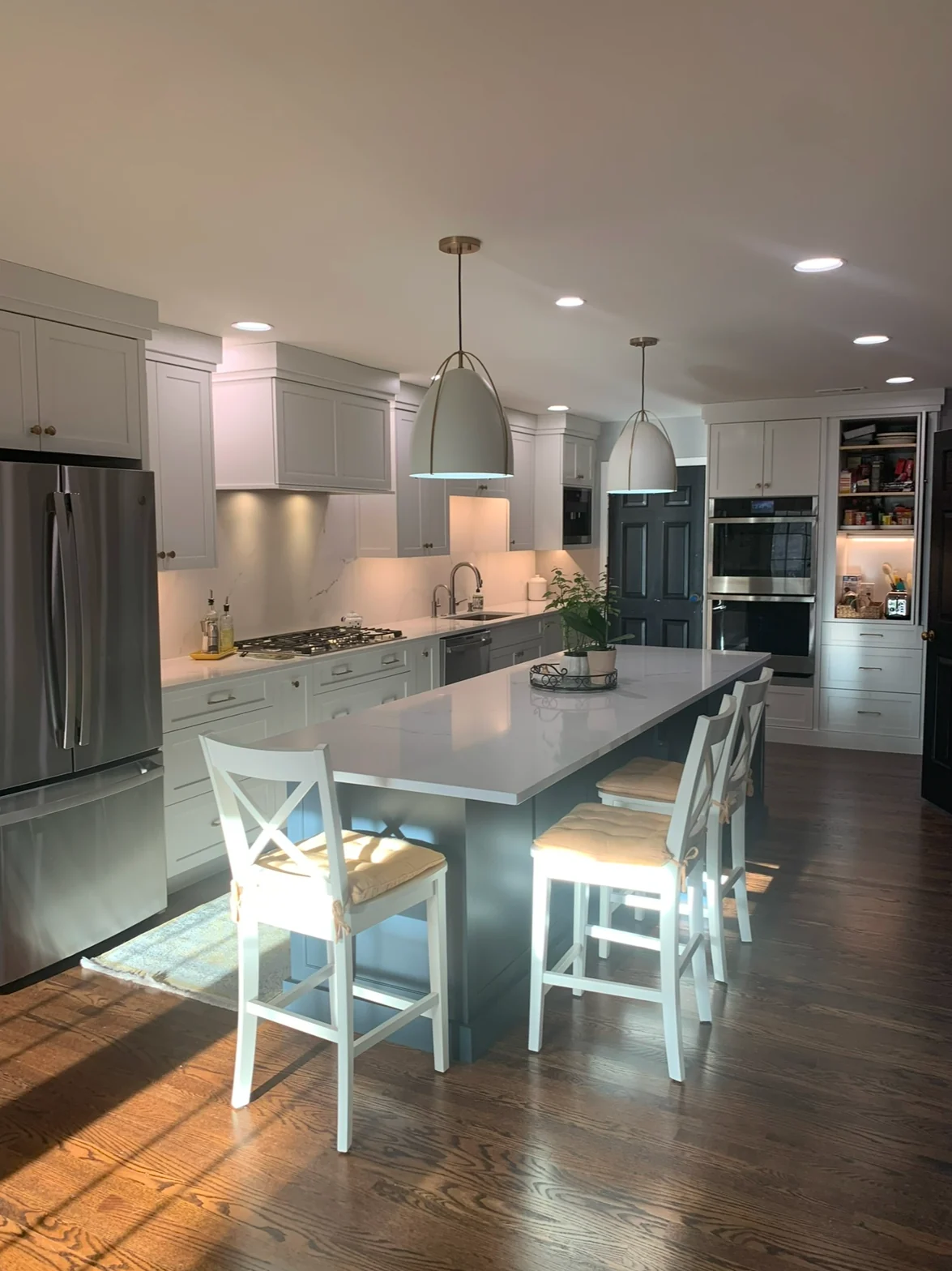 Sea Isle City kitchen with a gray island and adjoining living area