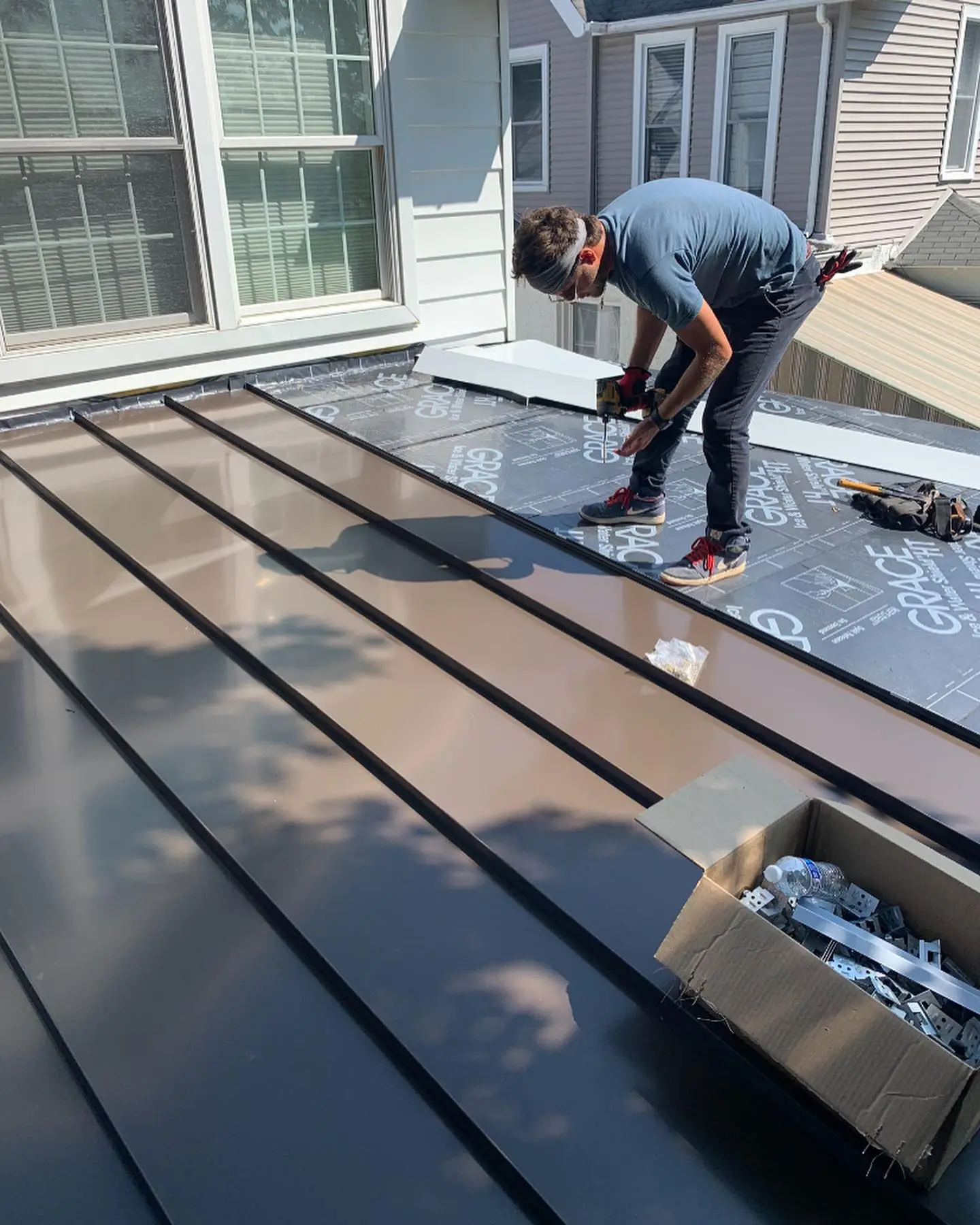 Michael John Contractors crew member performing residential roofing and construction work