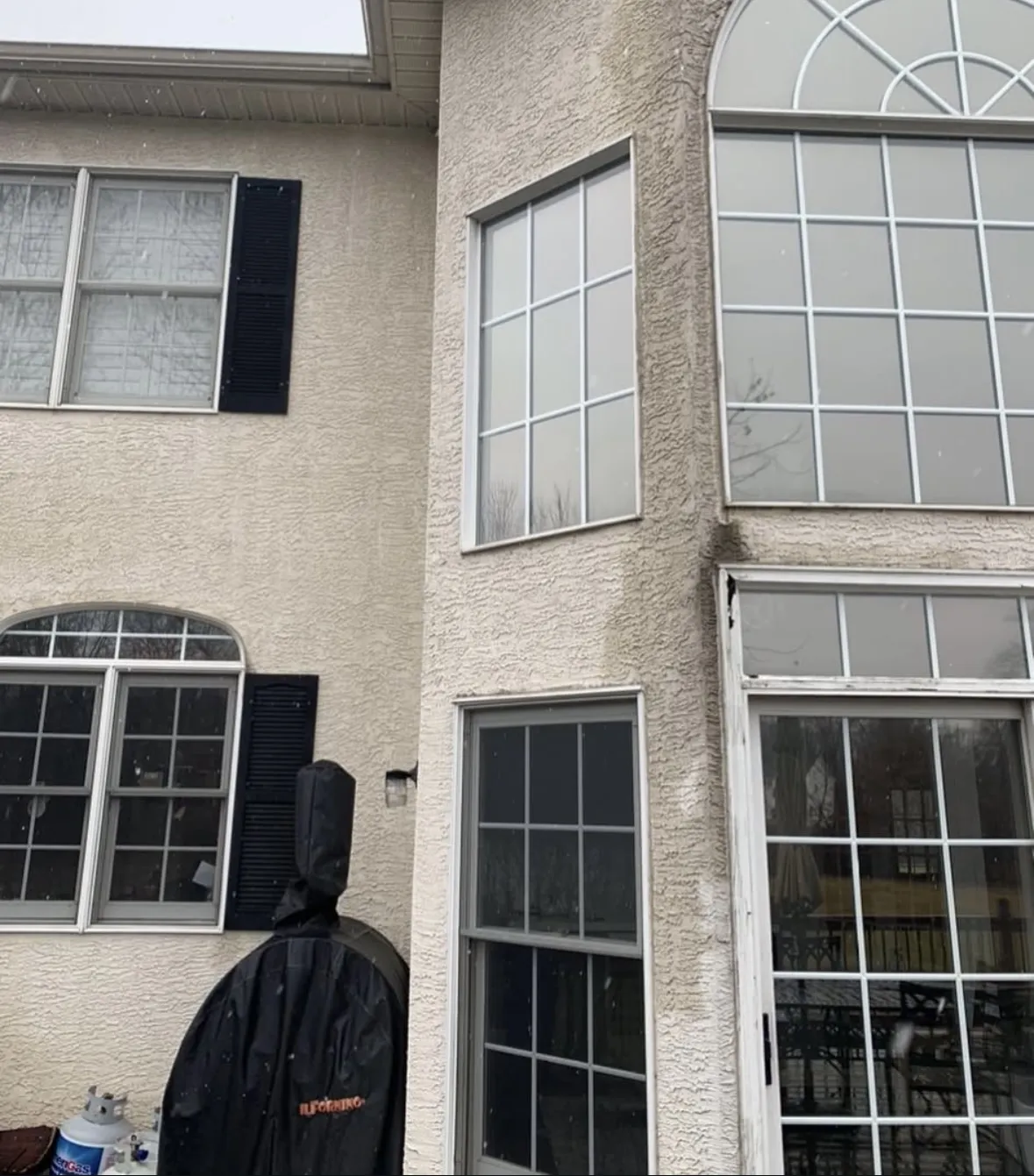 Exterior of a home before stucco remediation improvements