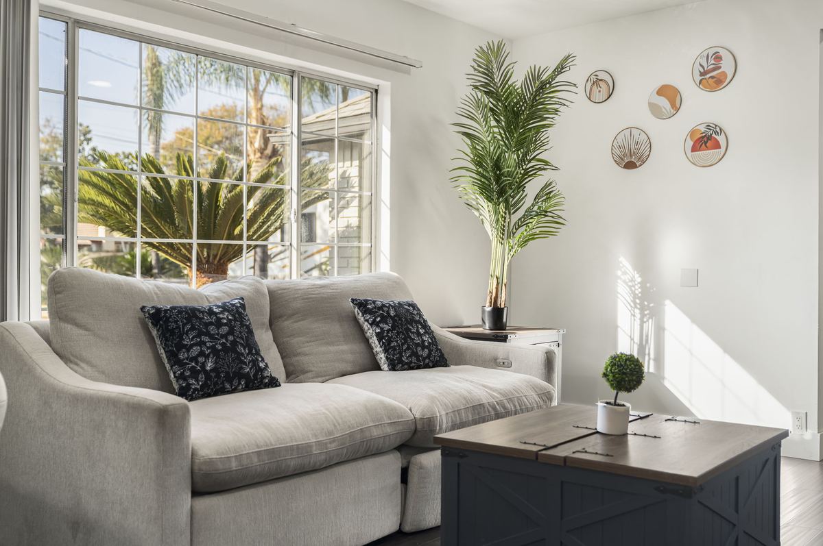Bright, comfortable living room at Chino Manor residential care home in Chino, CA