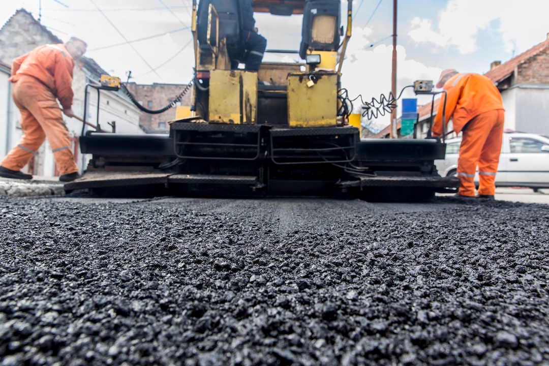 Close up of asphalt paver in action