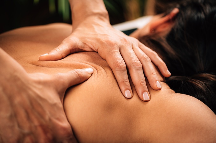Deep tissue massage along the spine performed by massage therapist in Asheville NC