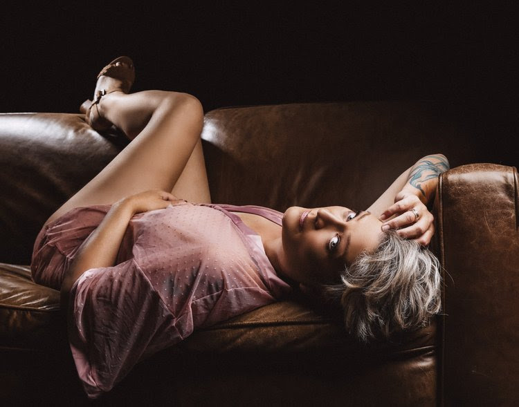 Woman on a couch in a robe