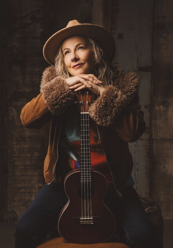 A portrait of a woman with an instrument