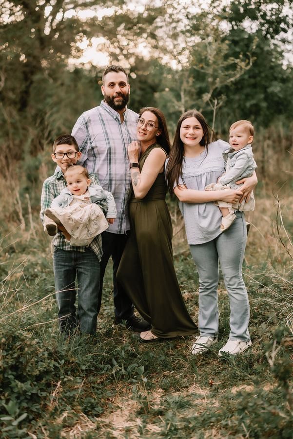 Family portrait session outdoors at golden hour