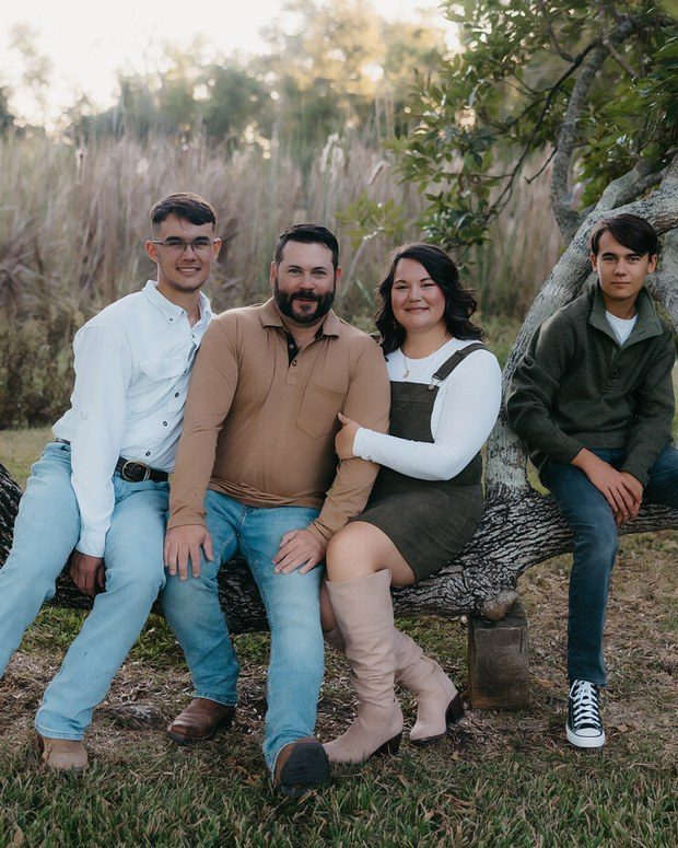 A family together outdoors in warm autumn light