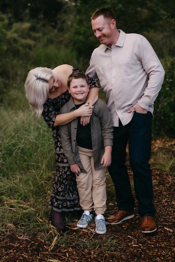 Family portrait session outdoors at golden hour