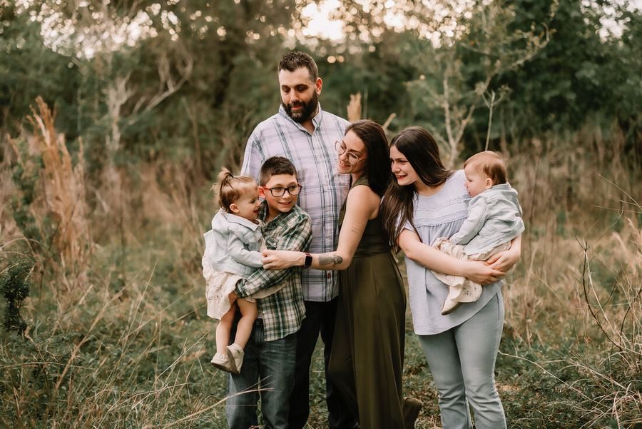 Family portrait session outdoors at golden hour