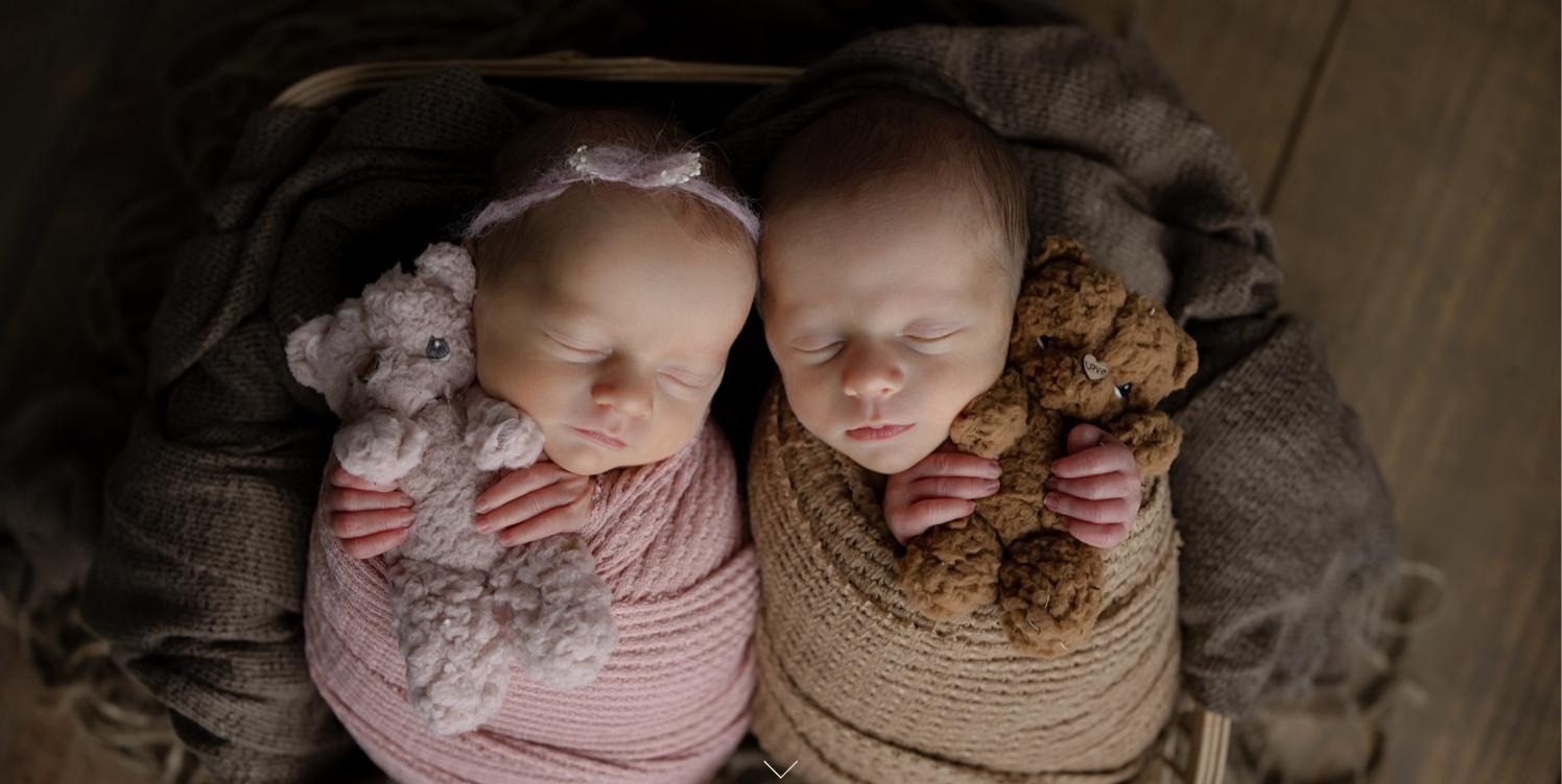 Newborn twins asleep together
