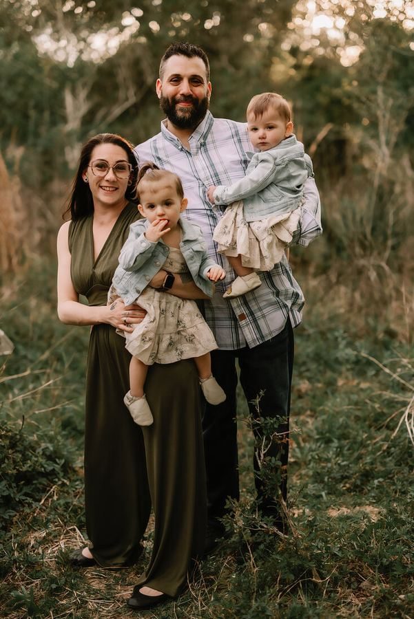 Family portrait session outdoors at golden hour