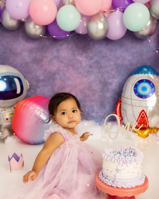 A first birthday cake smash setup