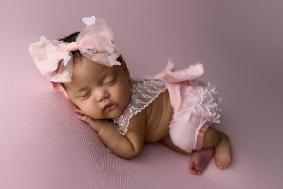 A newborn asleep during a studio session
