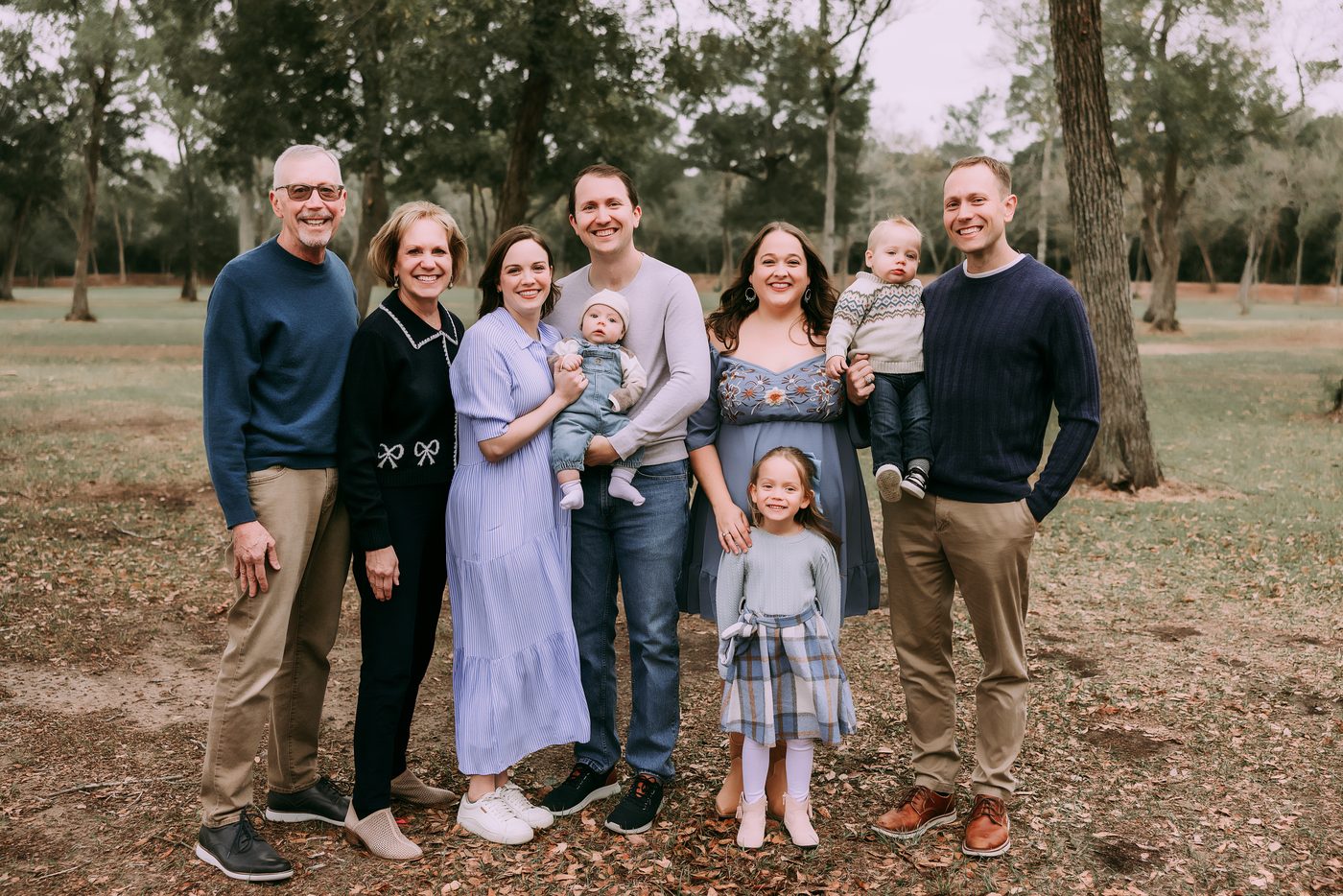 Extended family gathered outdoors at golden hour