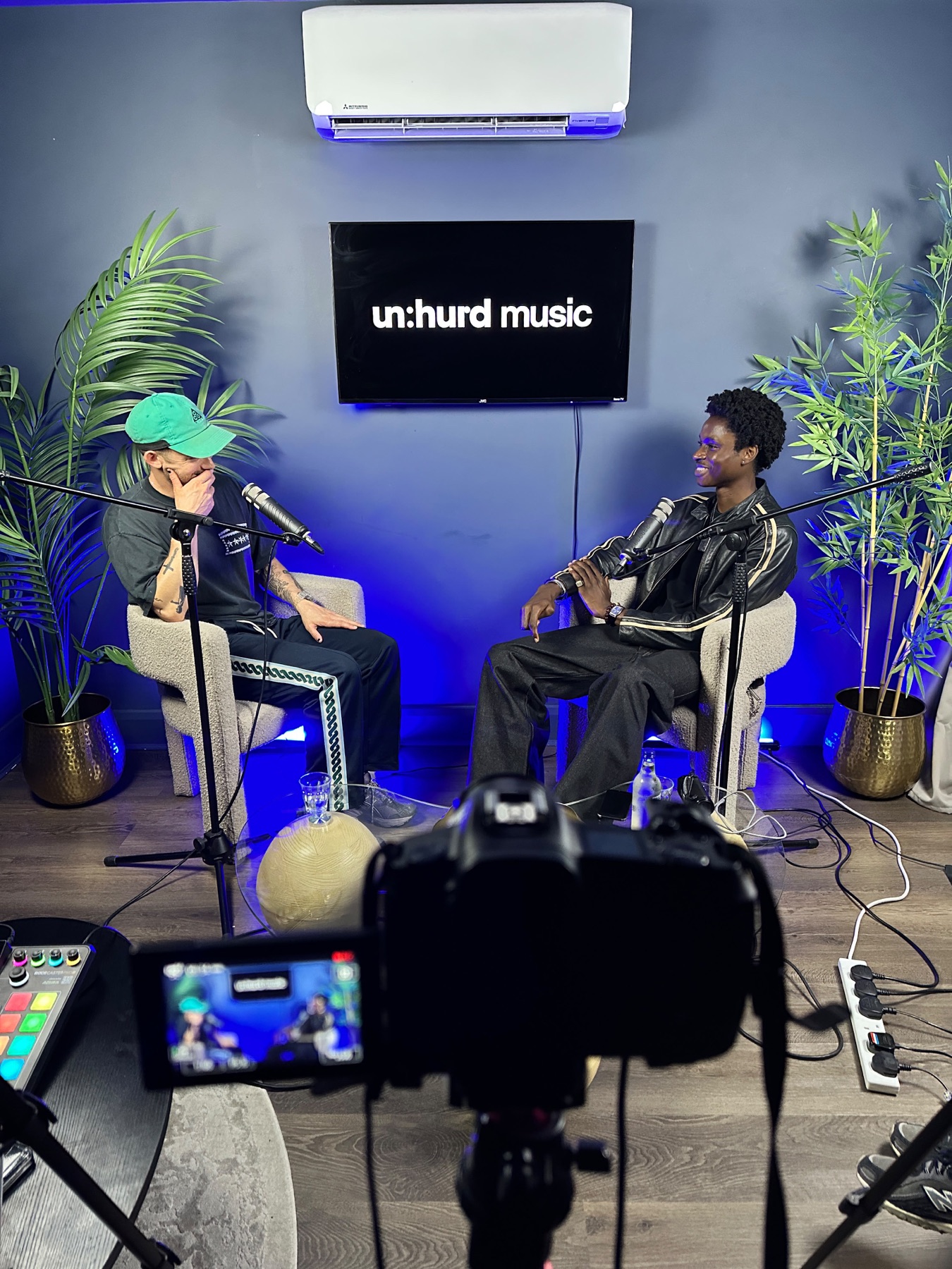 Two guests recording a multi-camera podcast in Mic Check Studio