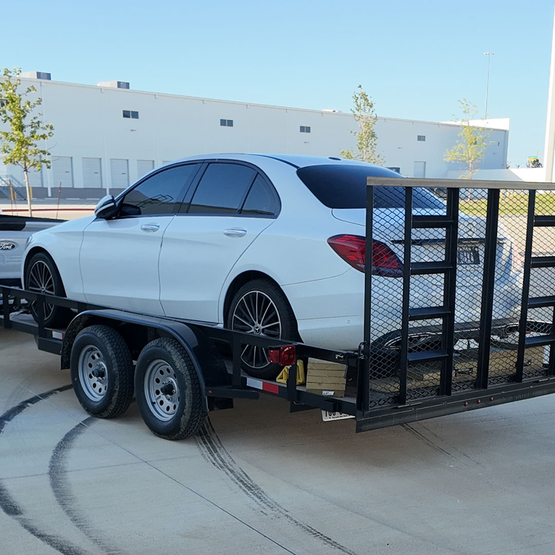 16Ft Utility trailer carrying the white car
