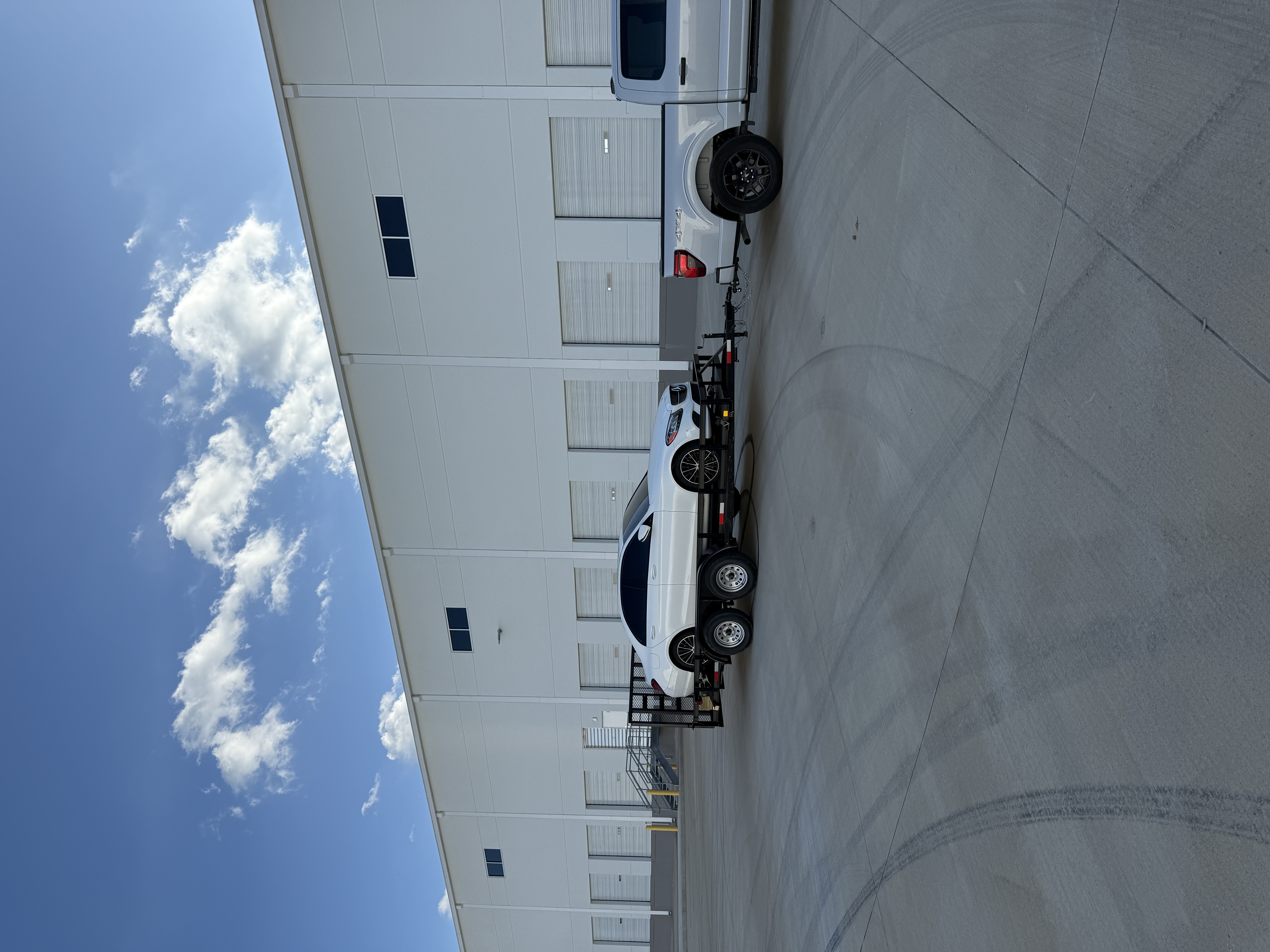 16Ft Utility trailer hauling the  white car