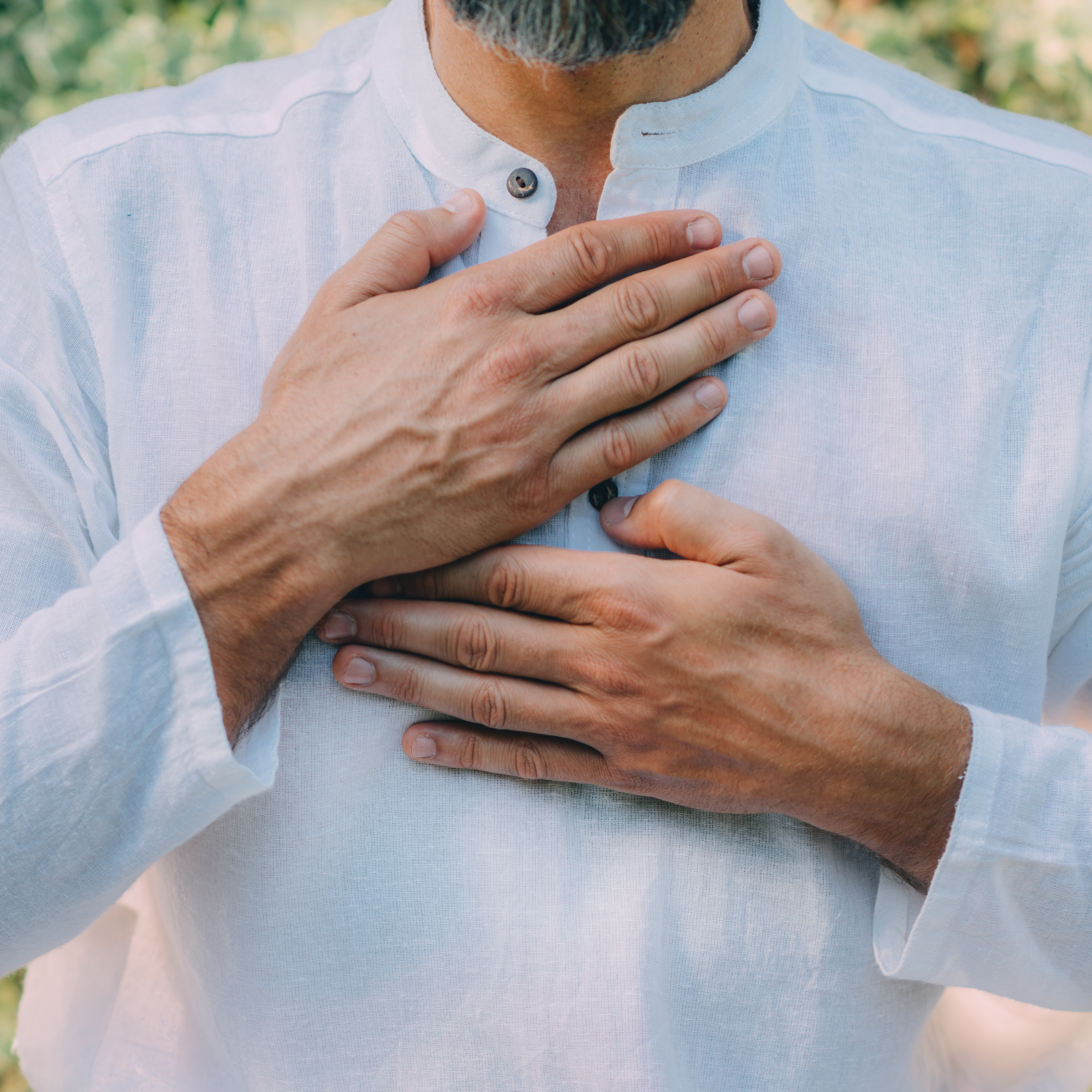 Person doing breathing exercise with hands on chest for nervous system regulation
