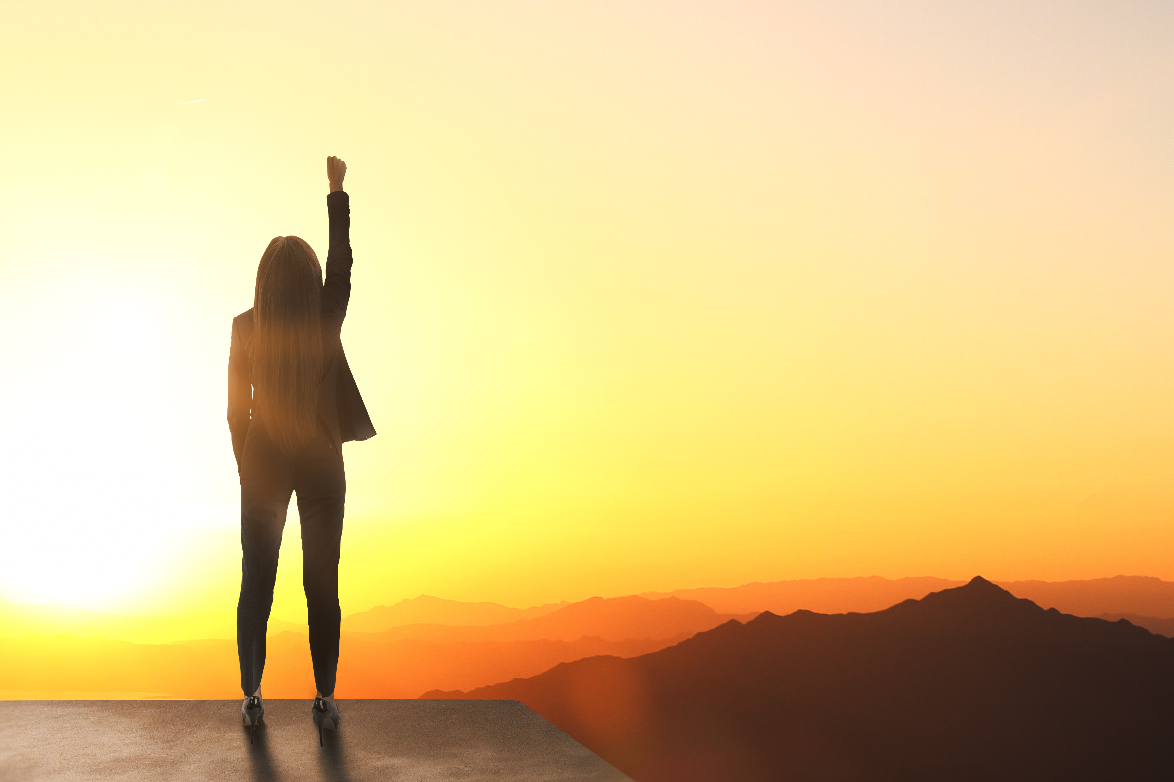 Person standing at sunrise symbolising personal growth through nervous system regulation