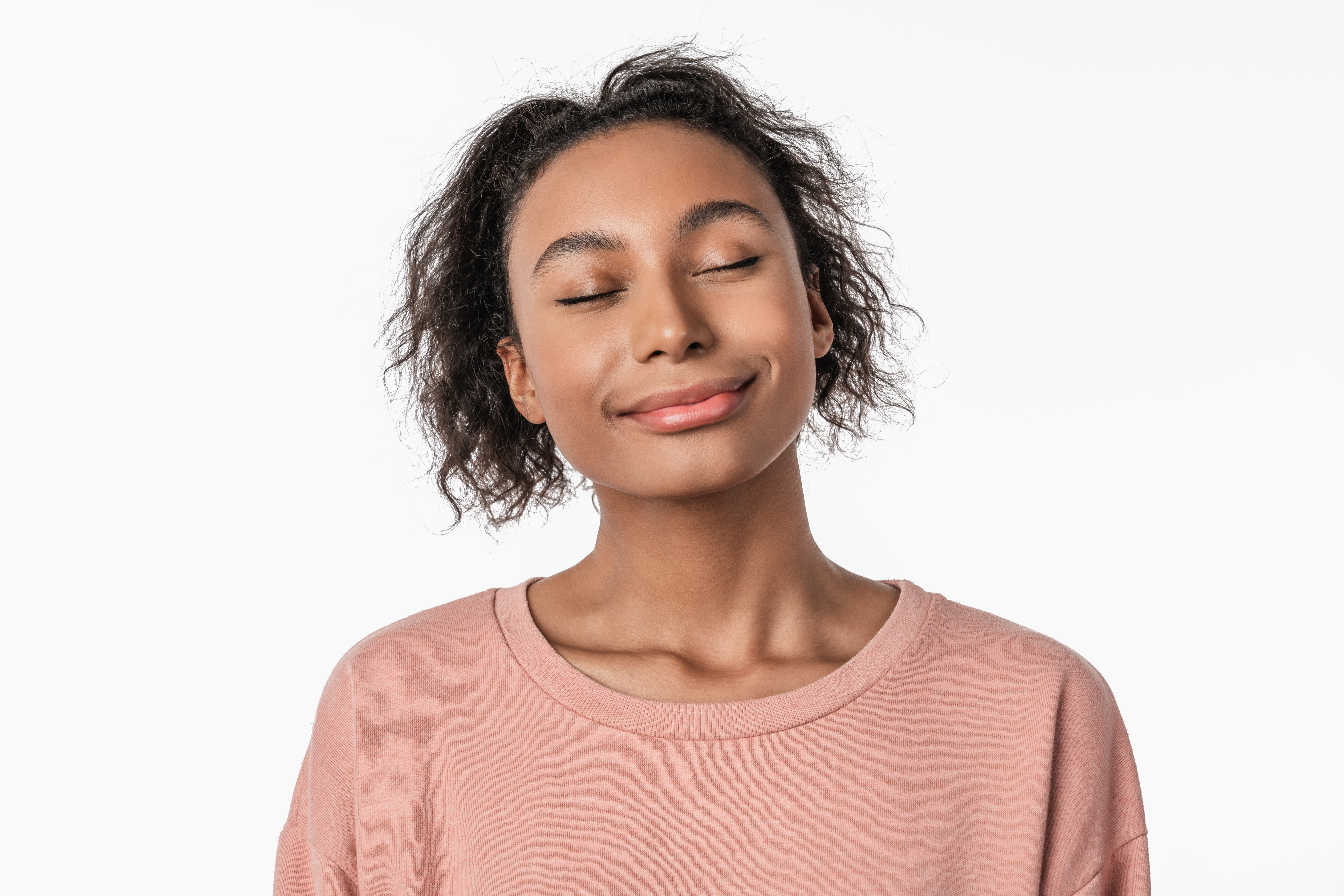 Person with eyes closed in calm breathing practice for nervous system regulation and conscious state shifting