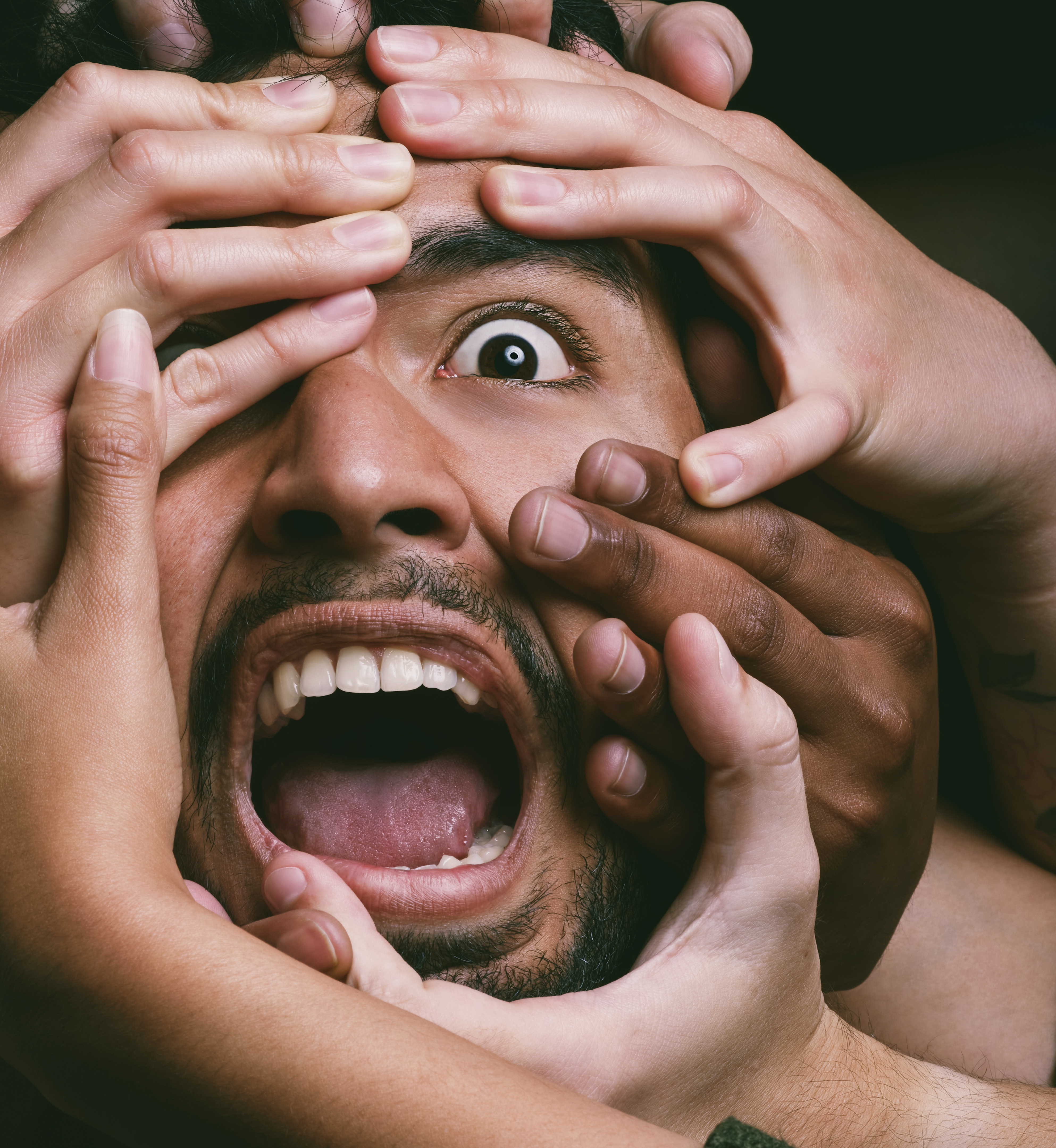 Person looking stressed and reactive in a crowded environment representing the red world nervous system activation state