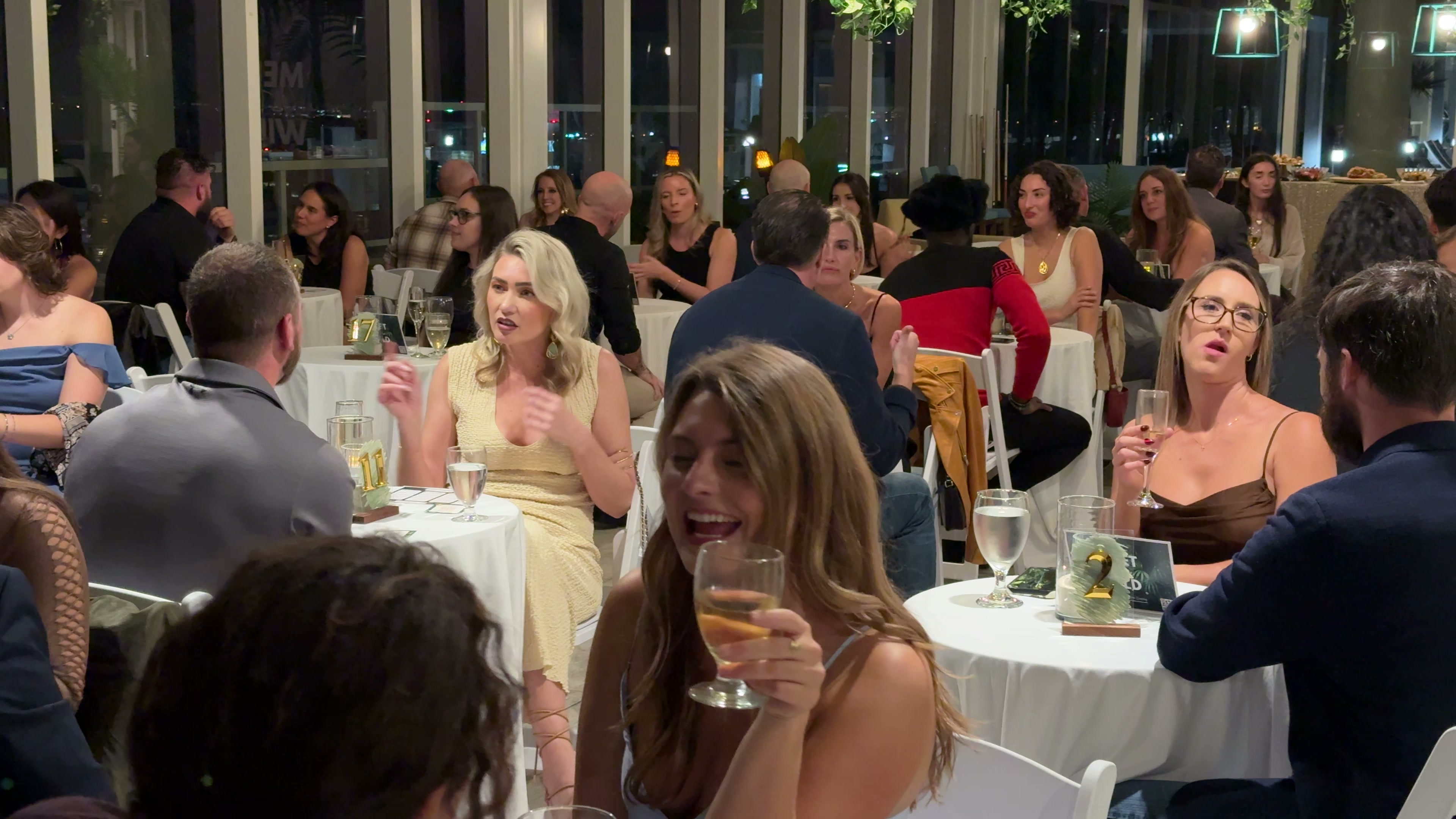 Men and women in conversation at a Meet In The Wild St. Pete event