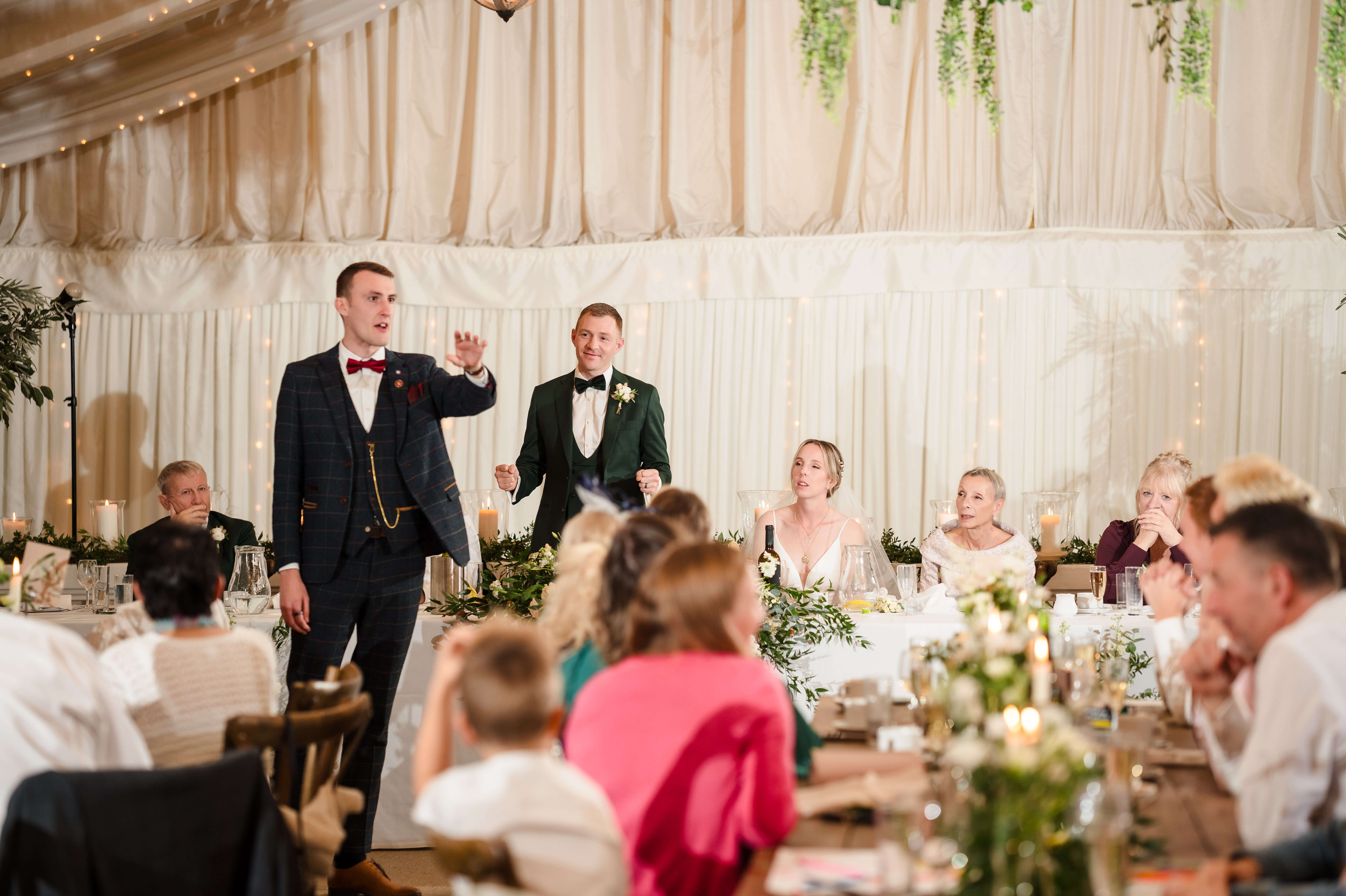 Wedding guests enjoying an interactive after-dinner magic show