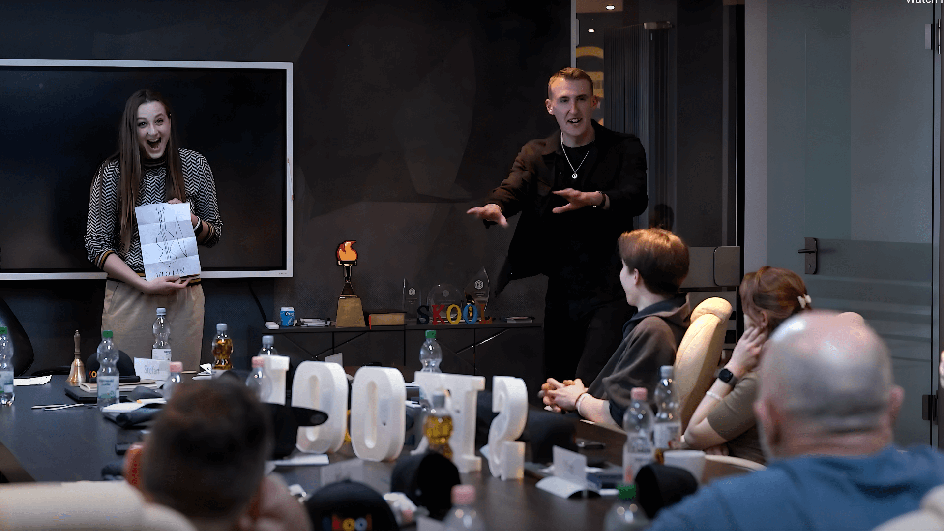 Guests watching an interactive after-dinner magic performance