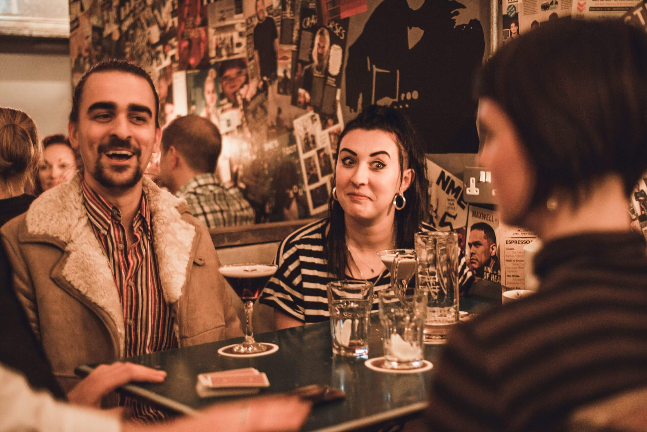 Guests enjoying close-up magic and mind reading during a private event