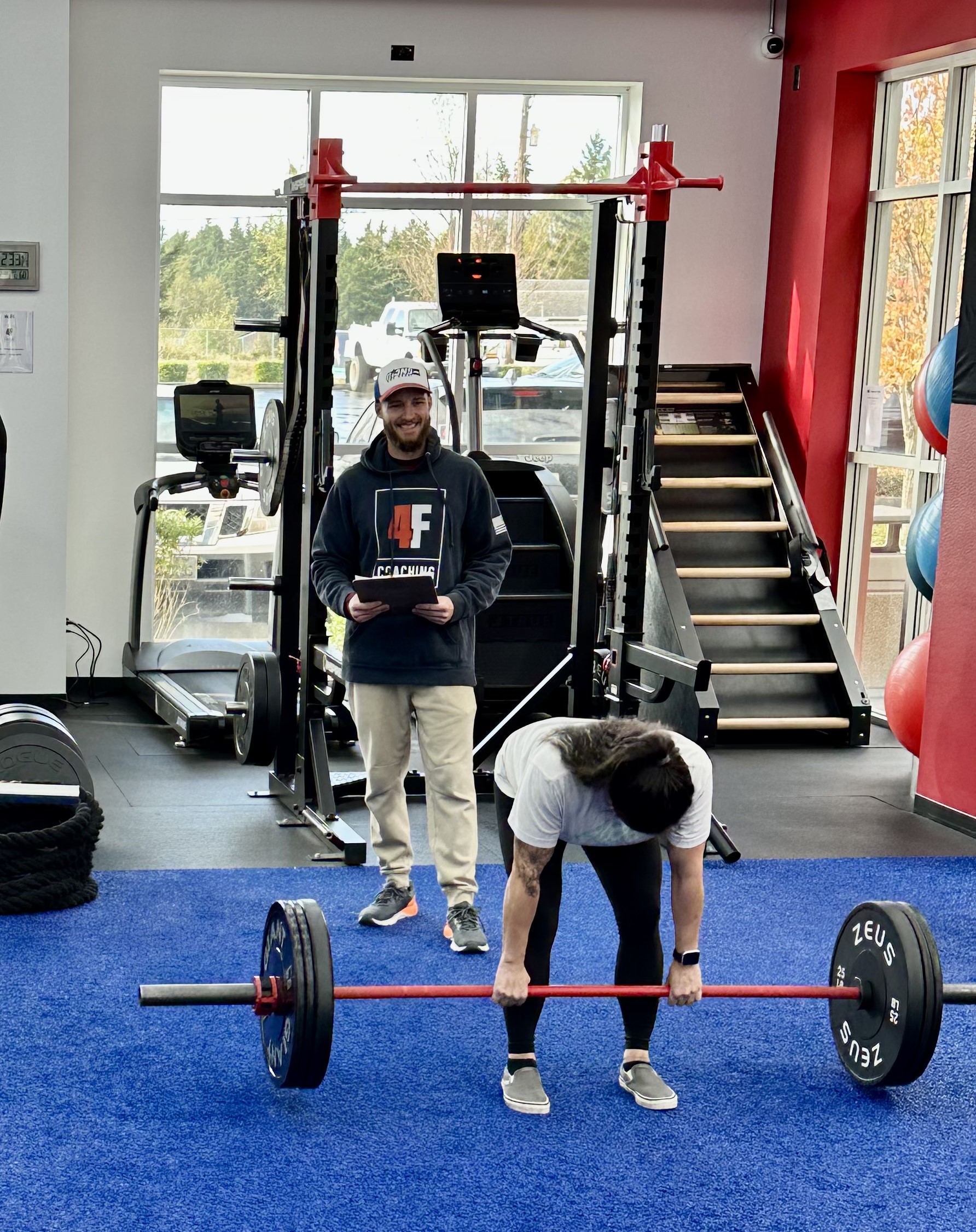 A 4F member deadlifting during a coaching session at 4F Coaching in Graham, WA