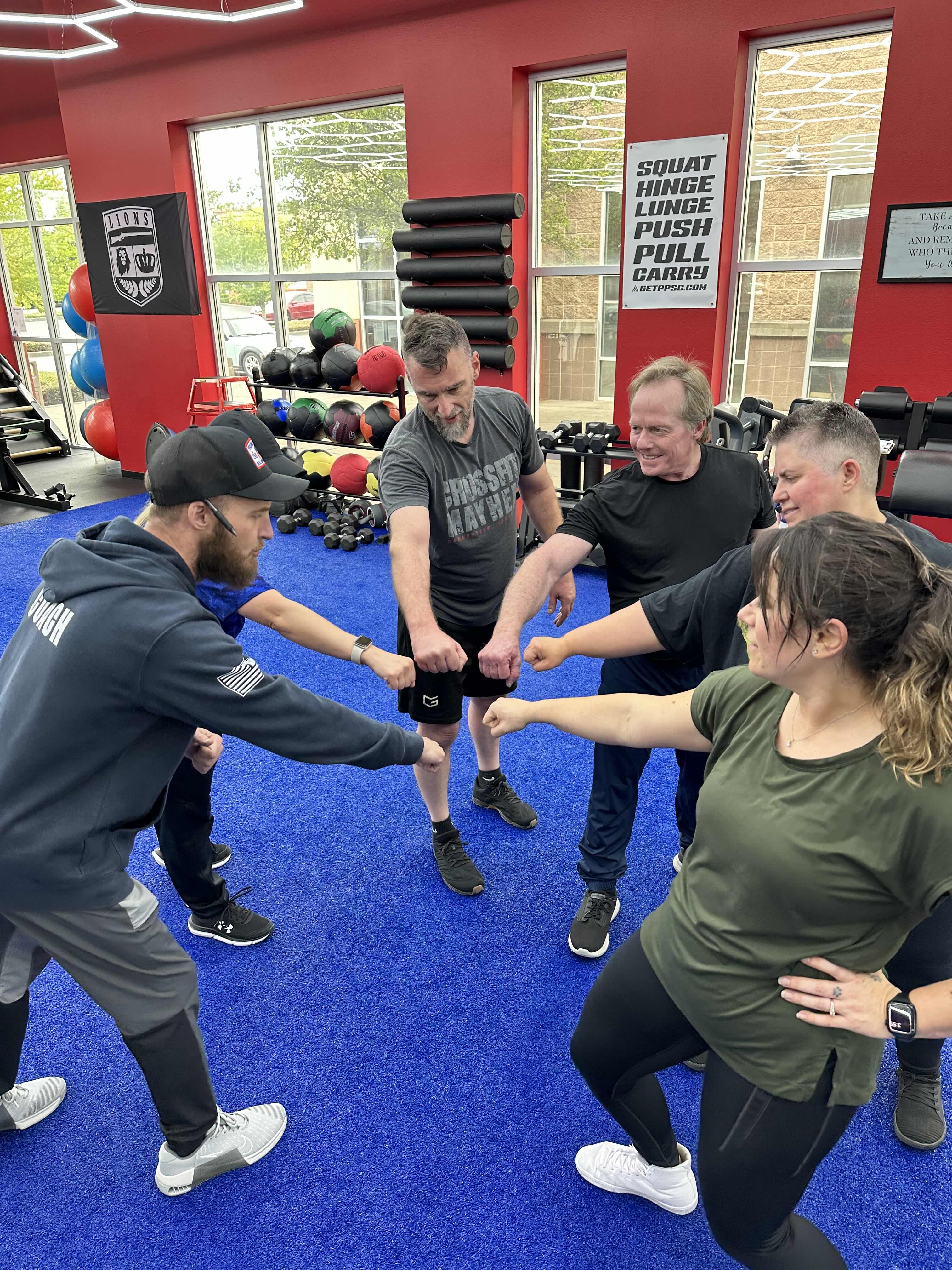 4F Coaching coaches and members in the Graham, WA training facility