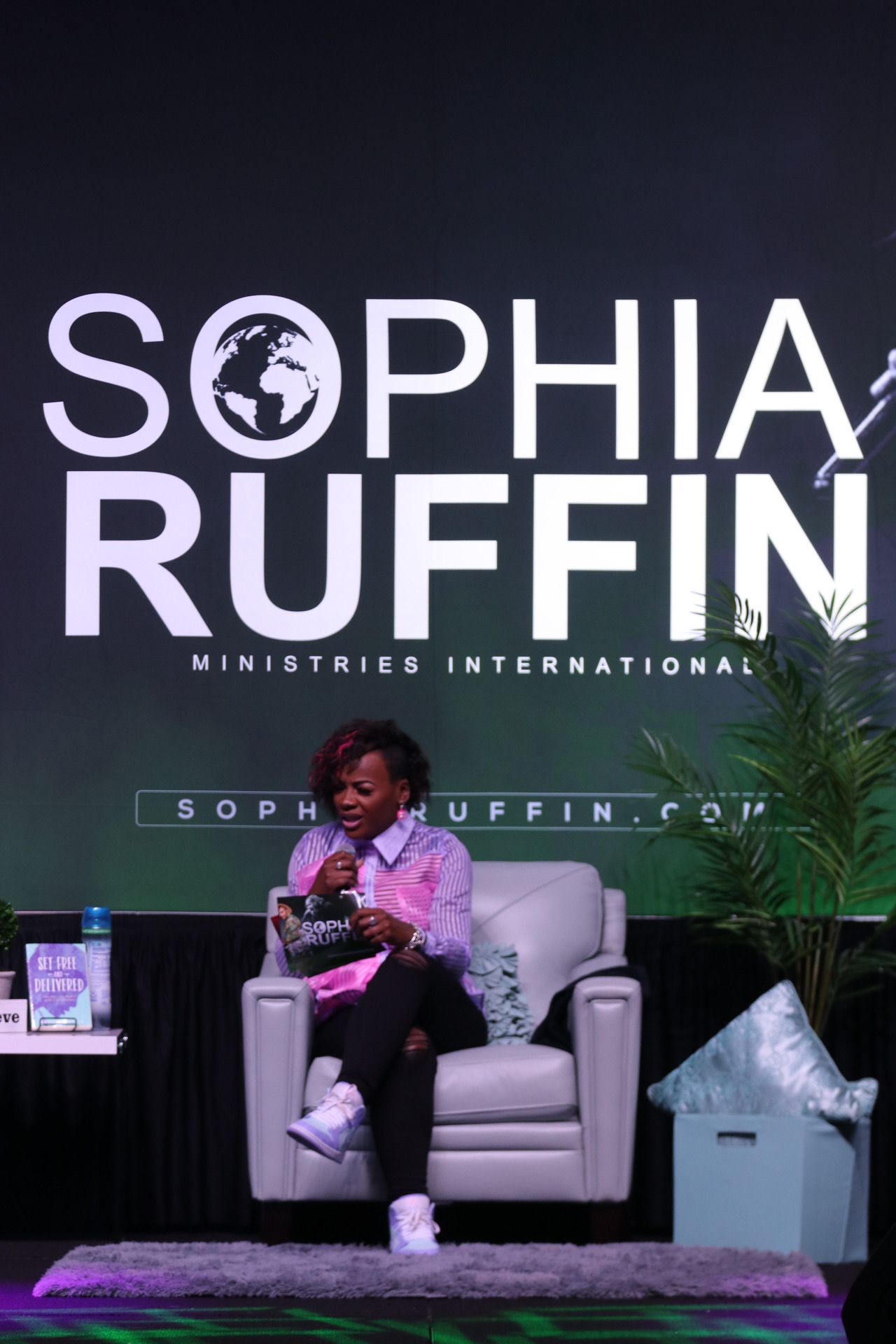 Sophia Ruffin teaching from a seated stage conversation