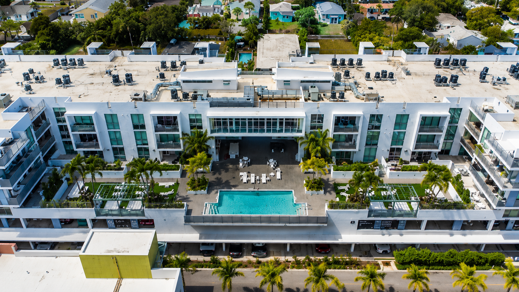 The Astor Delray Beach mid rise condo rooftop pool with cabanas