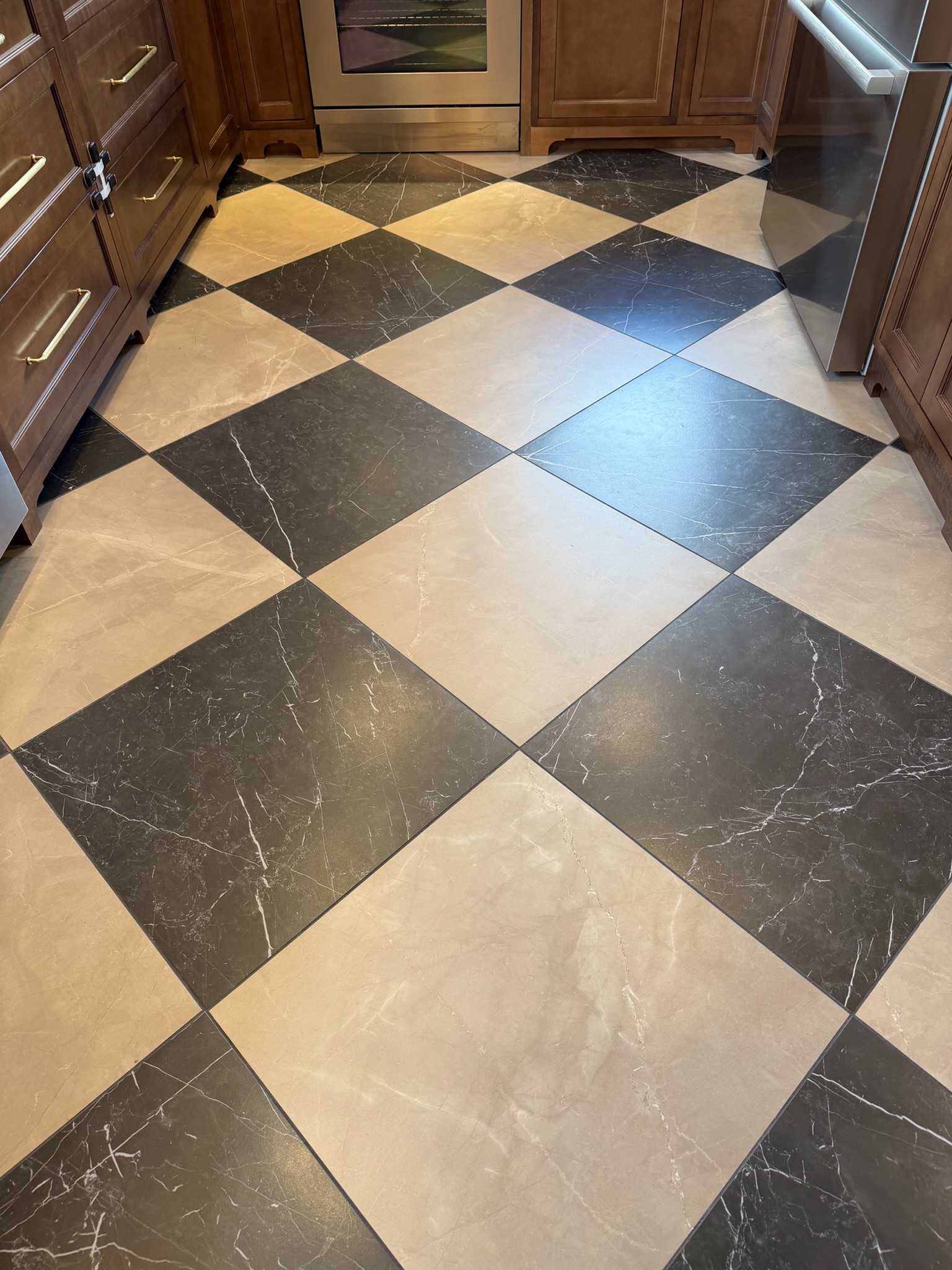 Finished tile work from a kitchen remodel by Envision Builders in Peru, Illinois