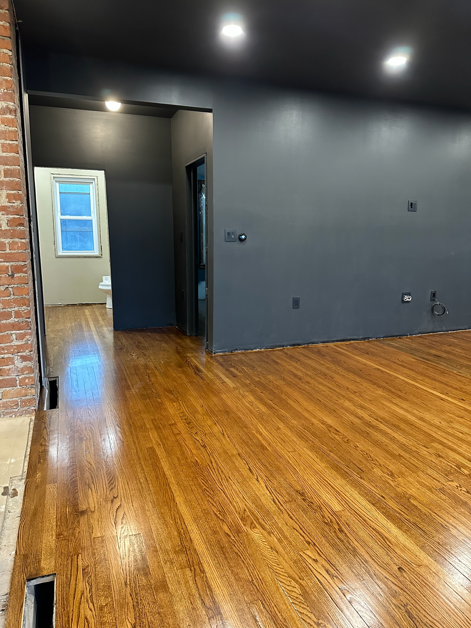Close up of finished hardwood flooring installed by Envision Builders in the Illinois Valley