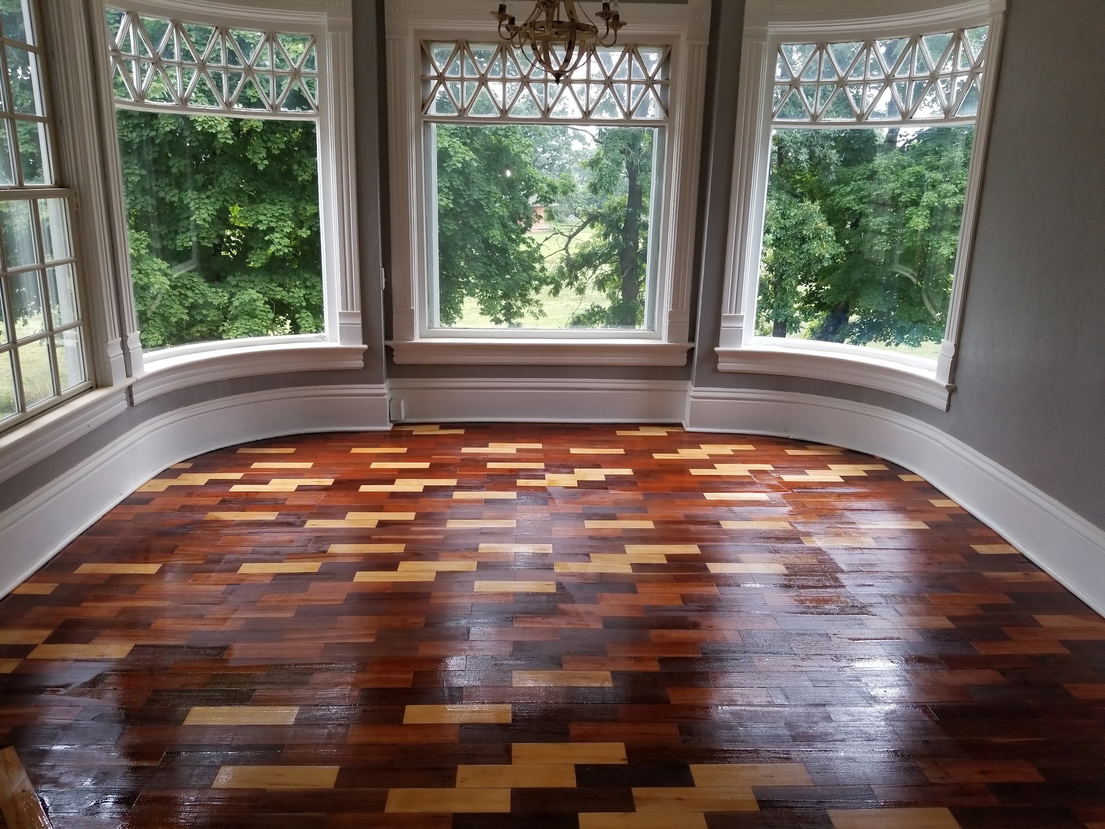 Finished specialty hardwood flooring installed by Envision Builders in the Illinois Valley