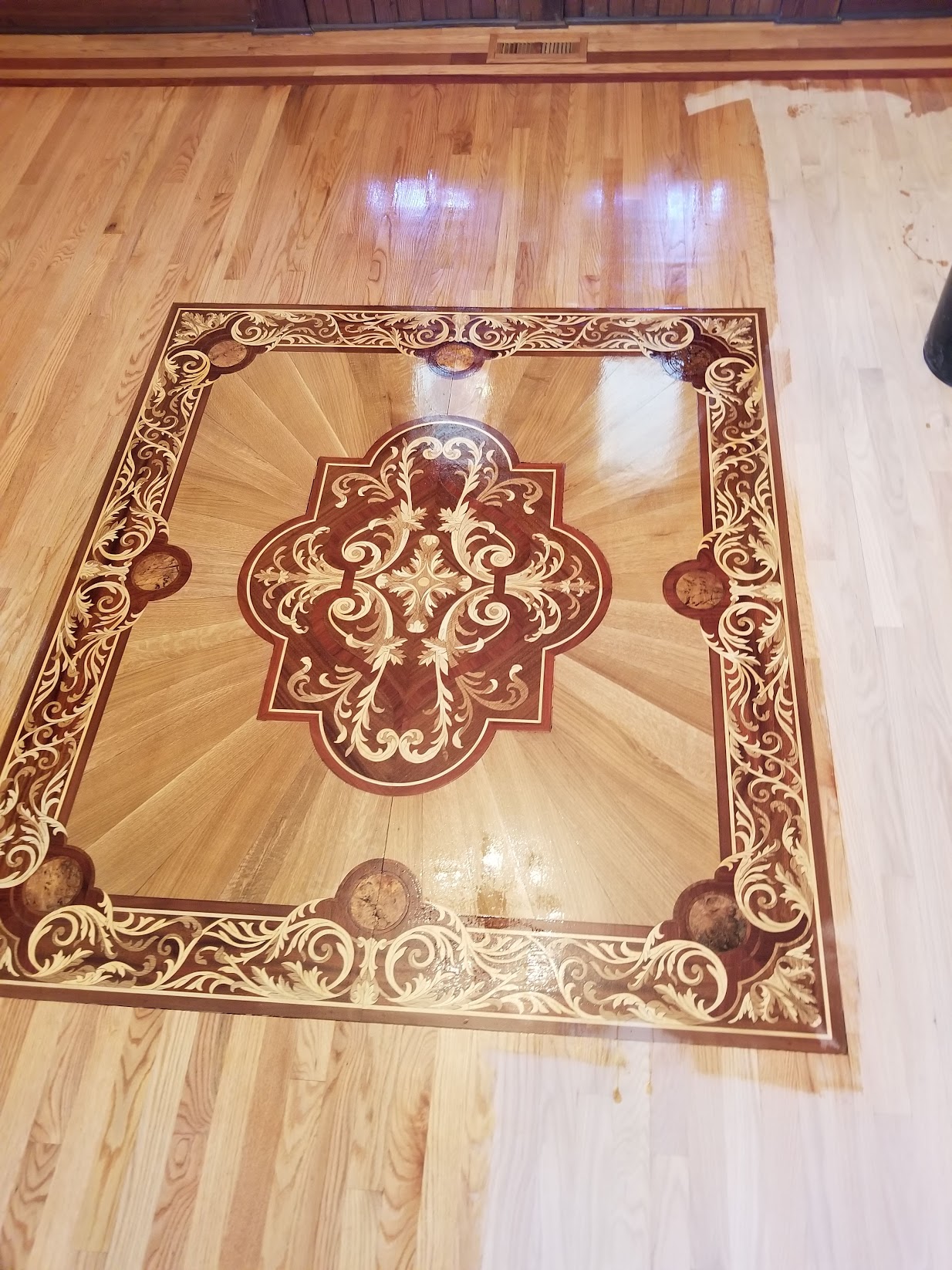 Finished specialty hardwood flooring installed by Envision Builders in the Illinois Valley